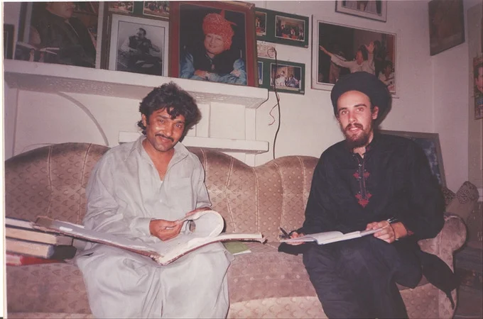 Translating & transliterating Ustad Nusrat Fateh Ali Khan's qawwali books with Ilyas Khan. 2003