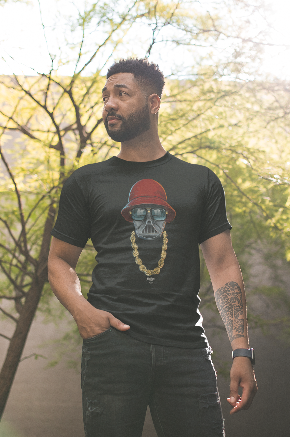 mockup-of-a-man-with-a-tshirt-and-black-jeans-against-a-tree-21351_.png