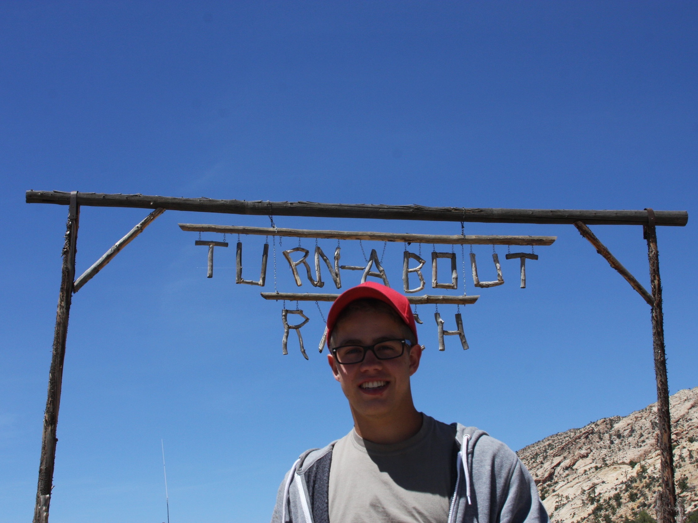   Standing in front of the entrance to Turn-About Ranch.  