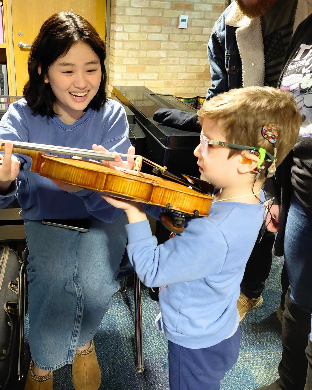 We were proud to partner with @sunshinecottageschool for an instrument petting zoo that gave their students the chance to connect with YOSA musicians to explore a variety of instruments up close, learning how they work and experiencing music in a han
