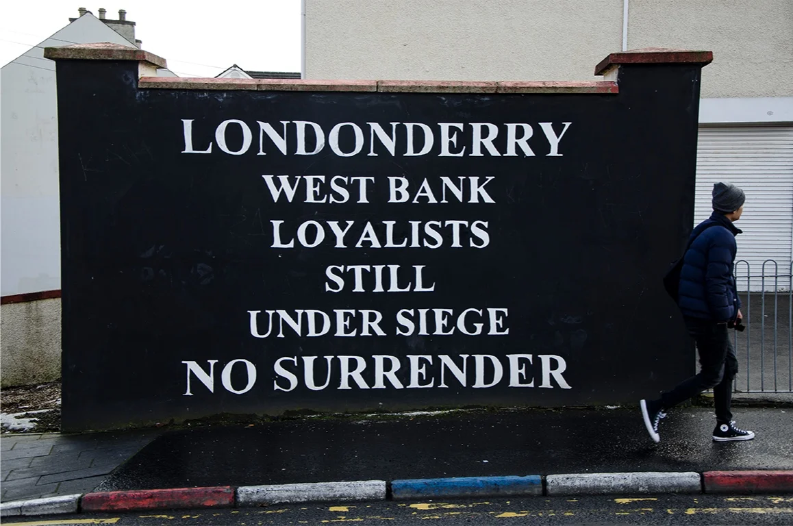 Derry_NI,NI_0000s_0025_loyalist_wall_with_tourist.png