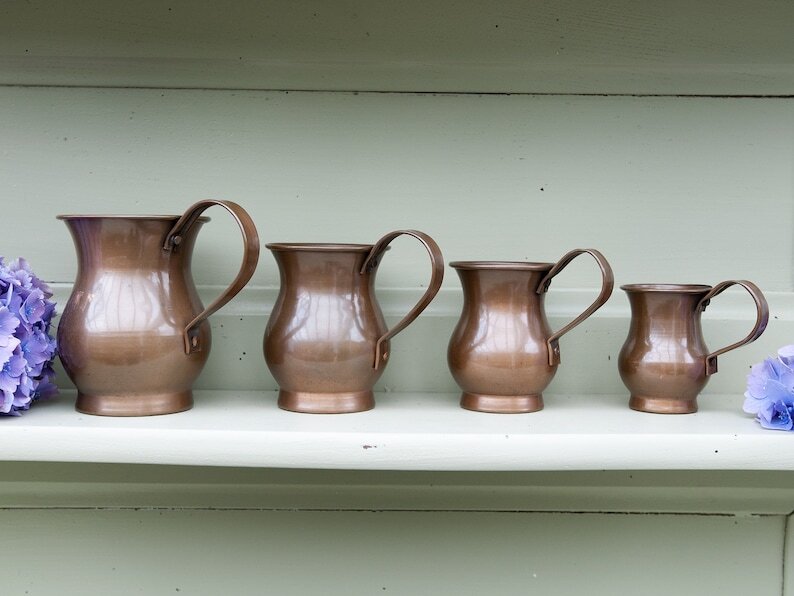 Vintage small decorative jugs in copper set of 4