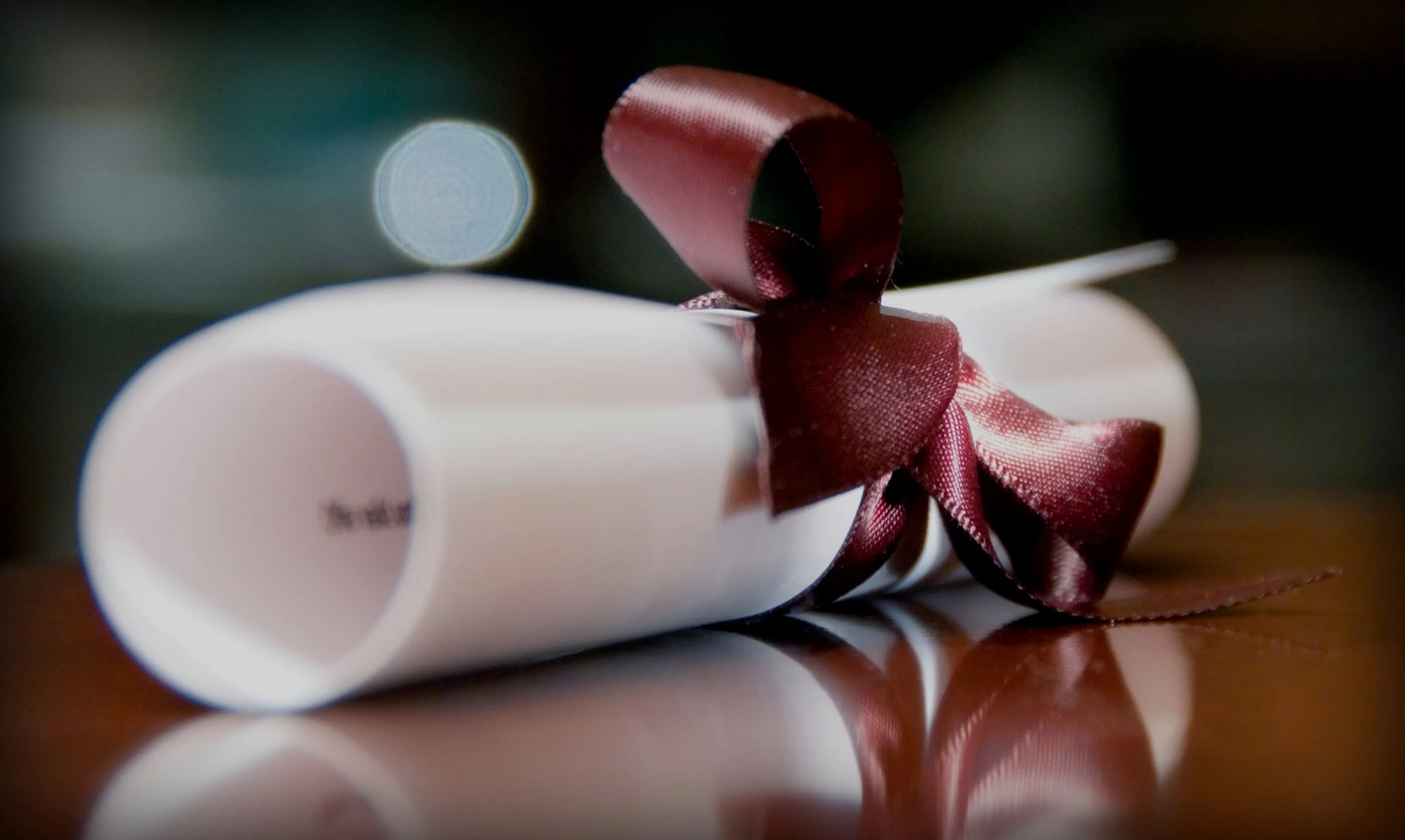 close-up-of-rolled-paper-scroll-tied-with-ribbon-688954997-5a5e92c789eacc003759b6c7.jpg
