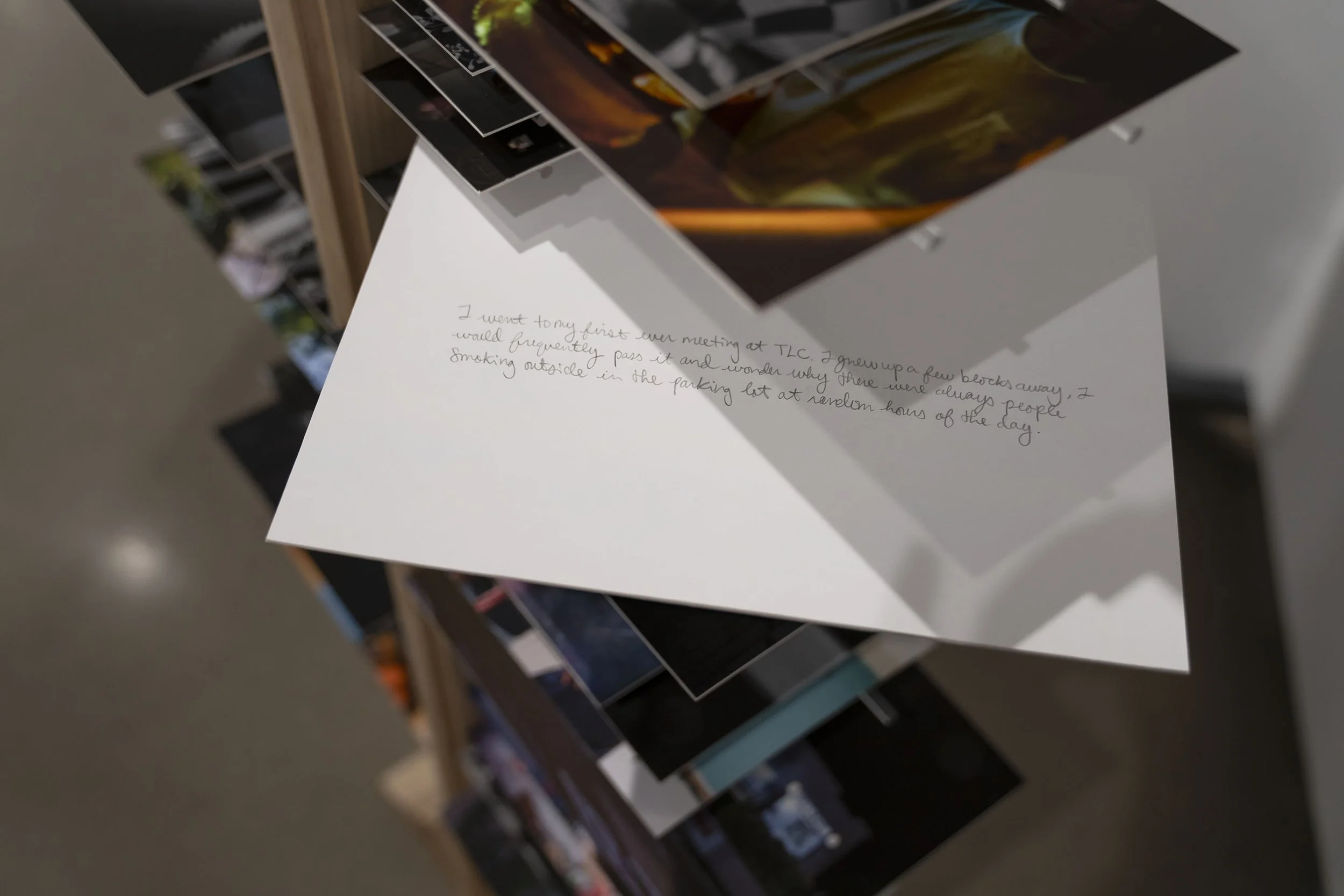 In Plain Sight, 2026 (dimensions: 67"h x 8"w x 5"d)
Materials: wood, 100 embossed photographs, 200 acrylic rods, text, recovery.
