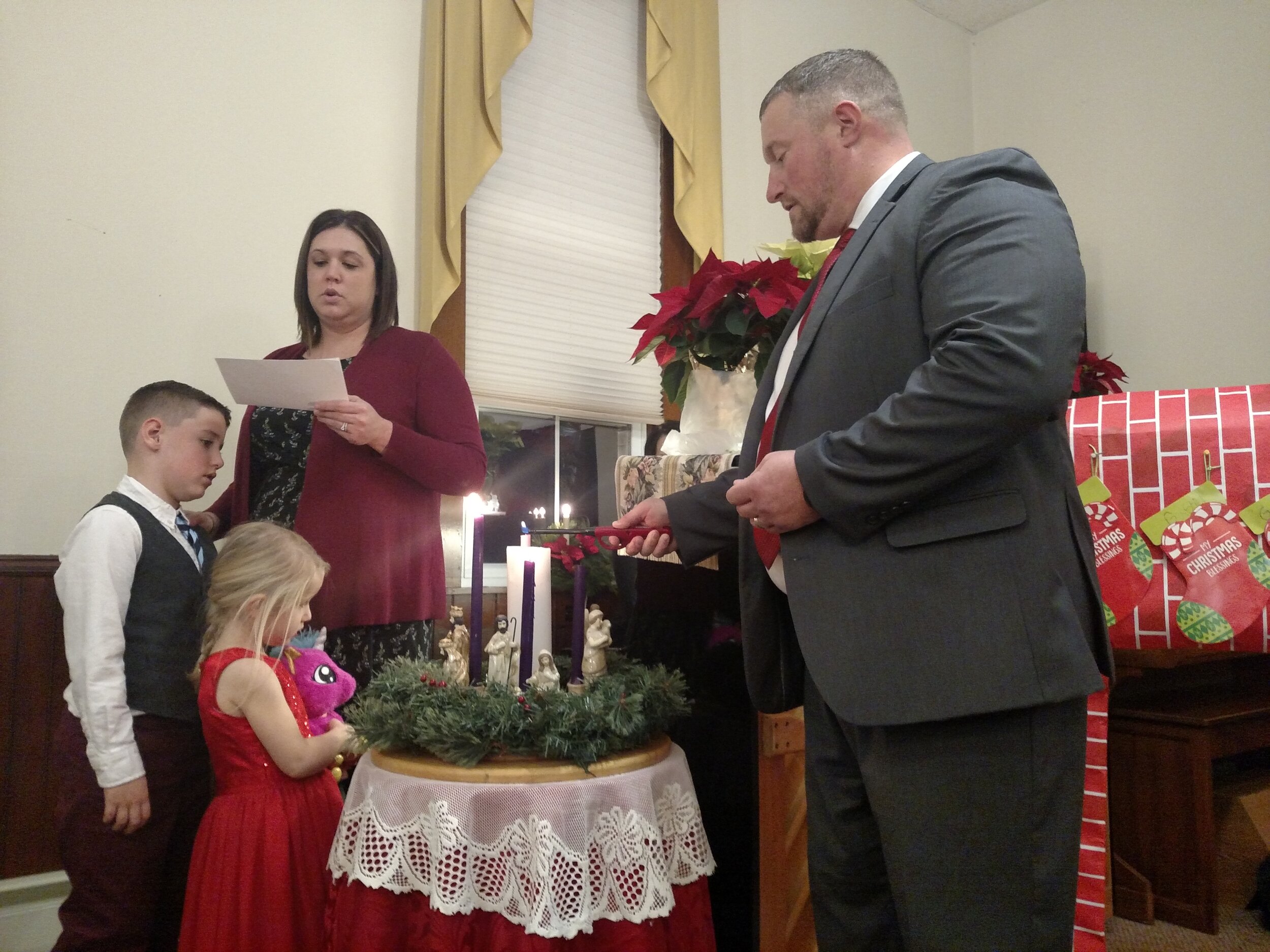 The Hatter Family lights the Christmas Eve candle on the Advent Wreath - 2019