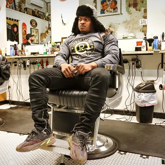 @topshotta_bj lounging in the shop. 📷 @d.m.r_photography