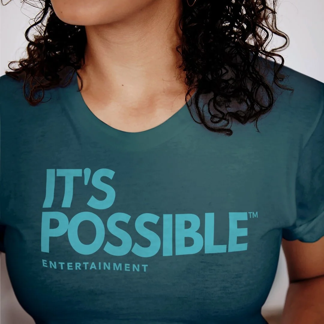 IPE-Merch-DarkTeal-Tshirt-AA-Female.jpg