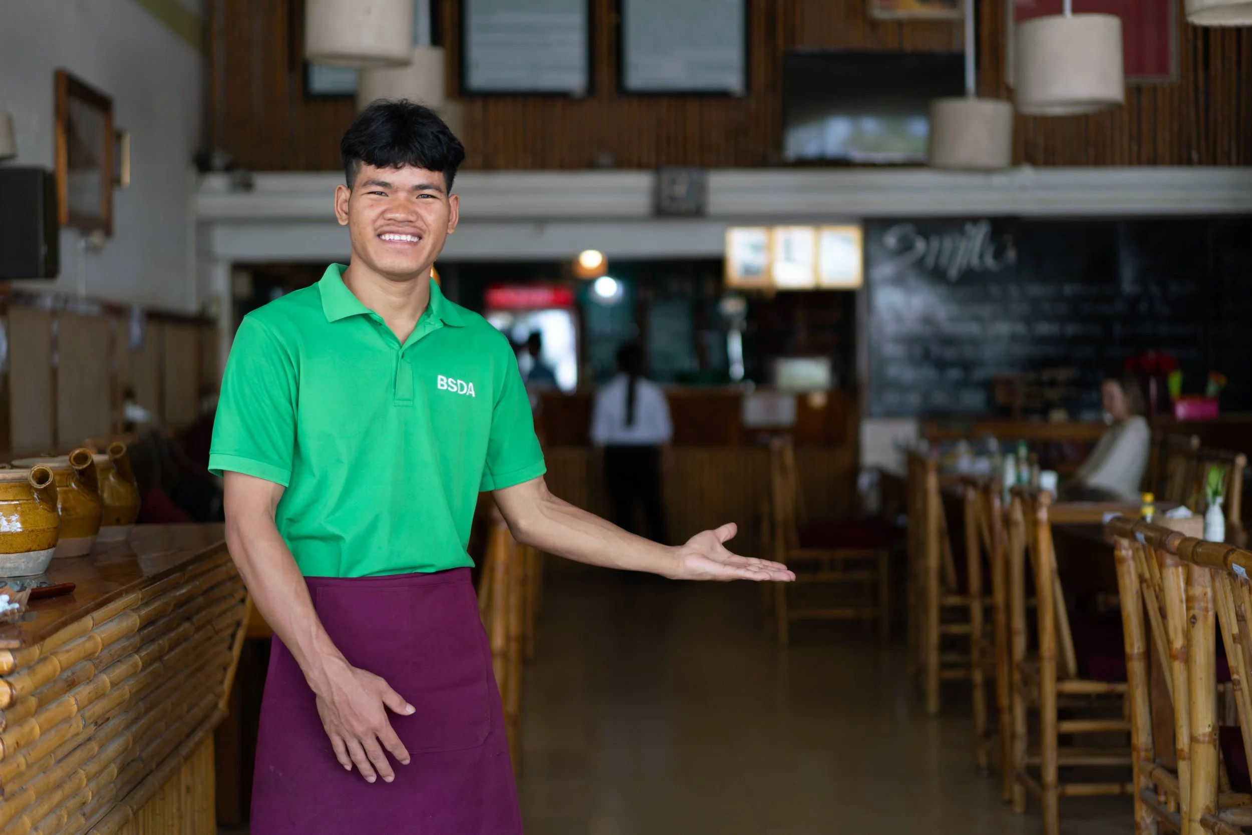 boy happily welcoming you to smile restaurant