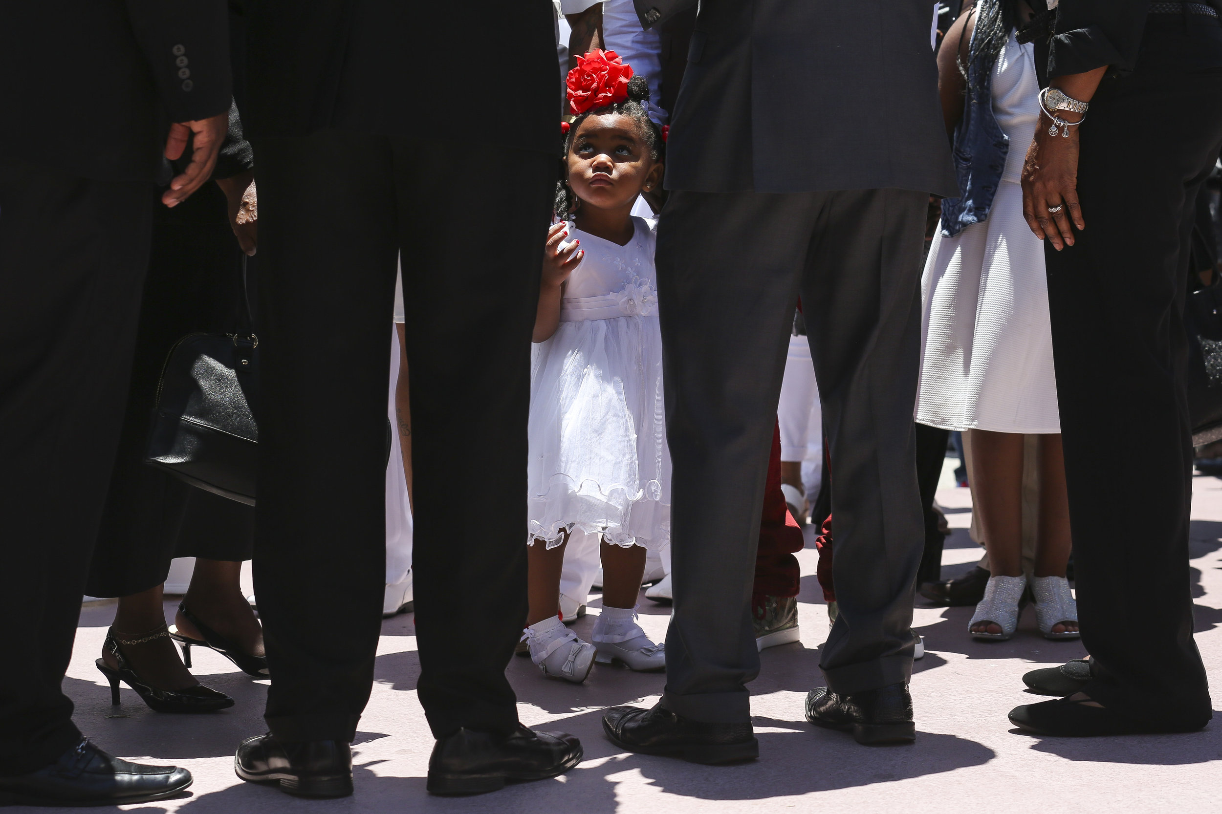  Tedrika King, 2, waits outside before the start of a funeral service for her 13-year-old sister, Tedra King, at Second Baptist Church in Richmond Heights on Saturday, May 6, 2017. Tedra King was a victim to gun violence after being accidentally shot