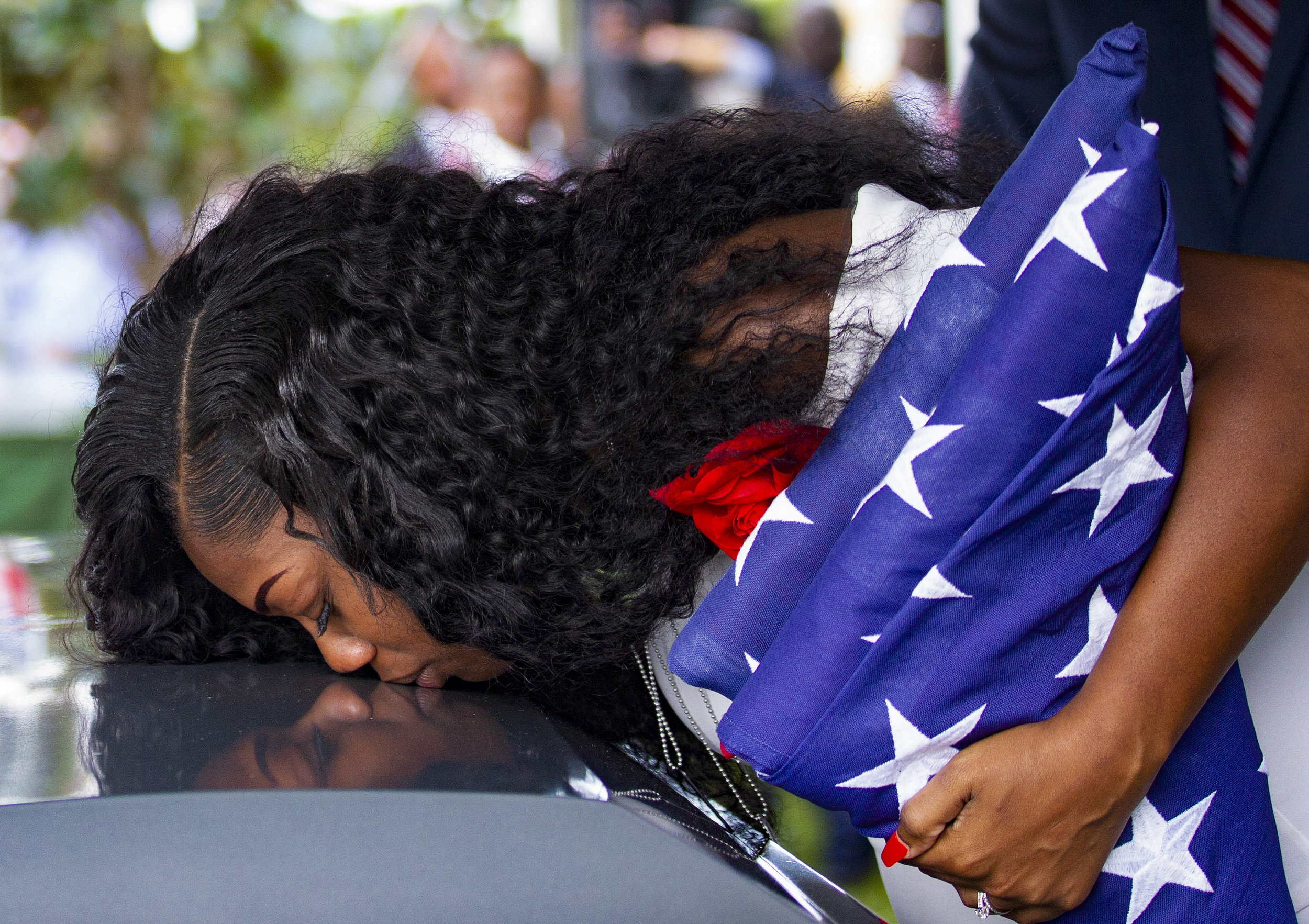  Myeshia Johnson kisses the casket of her husband, Sgt. La David Johnson, during his burial service at Fred Hunter's Hollywood Memorial Gardens in Hollywood, Florida on Saturday, October 21, 2017. 