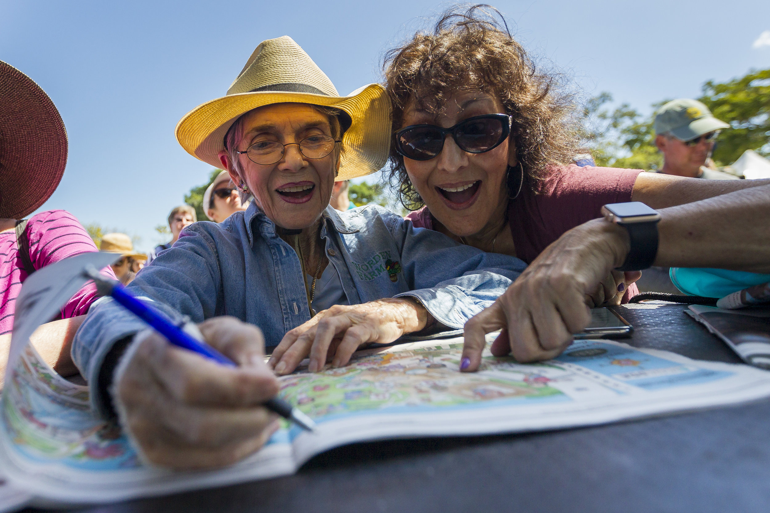  Pepi Granat, left, and her friend, Karen Shane, write down clues during the 2018 Herald Hunt at Museum Park in downtown Miami on Sunday, March 4, 2018. 