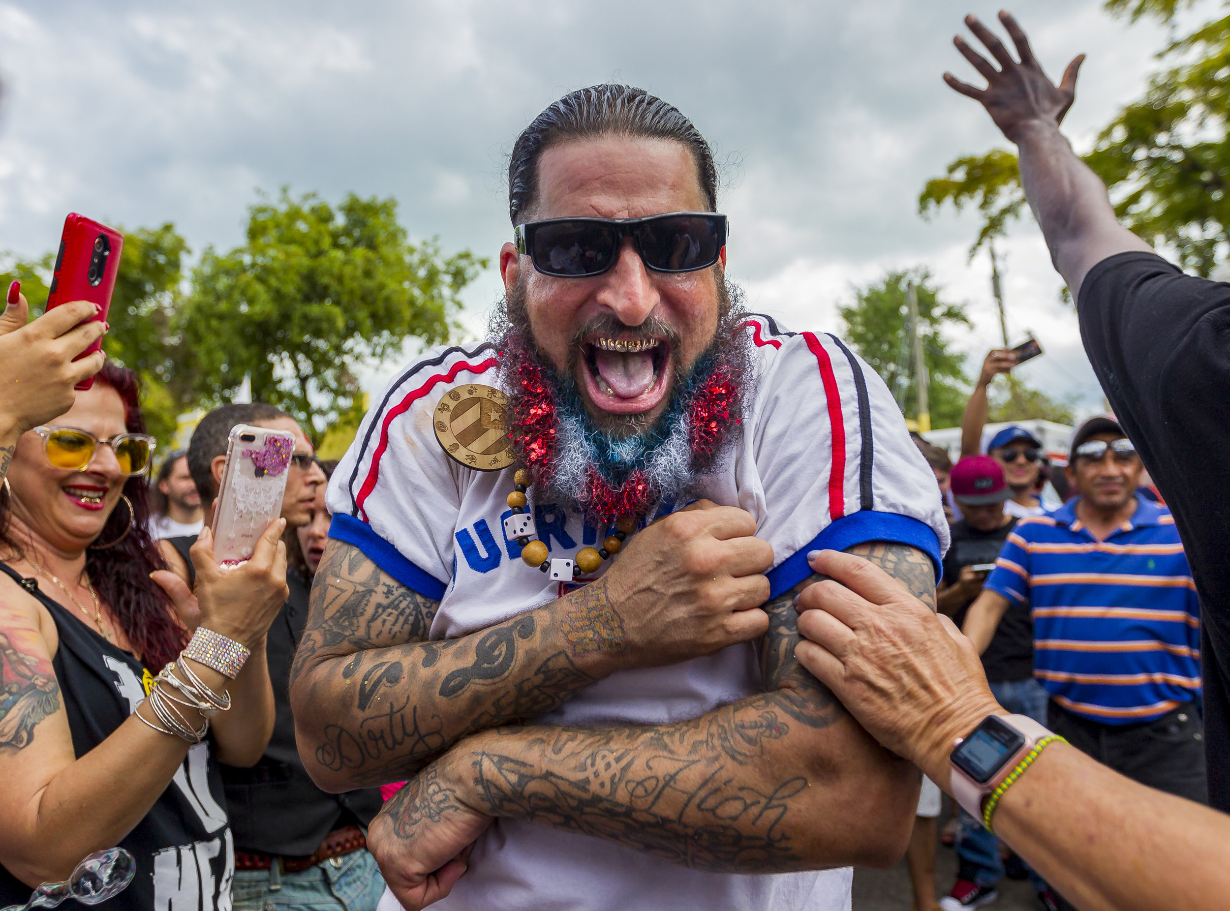  Vince Colon dances in the middle of a crowd during the Carnival Miami Calle Ocho festival in Little Havana on Sunday, March 11, 2018. 
