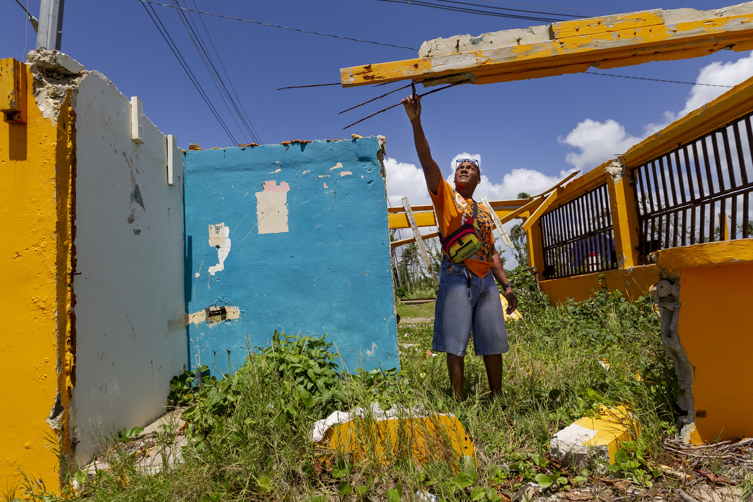  Jose Luis Aponte Cruz, 52, walks through the ruins of his beachside food kiosk "El Amarillo" in the Punta Santiago community of Humacao, Puerto Rico on August 23, 2018. Aponte Cruz lost his business during the passage of Hurricane Maria. 