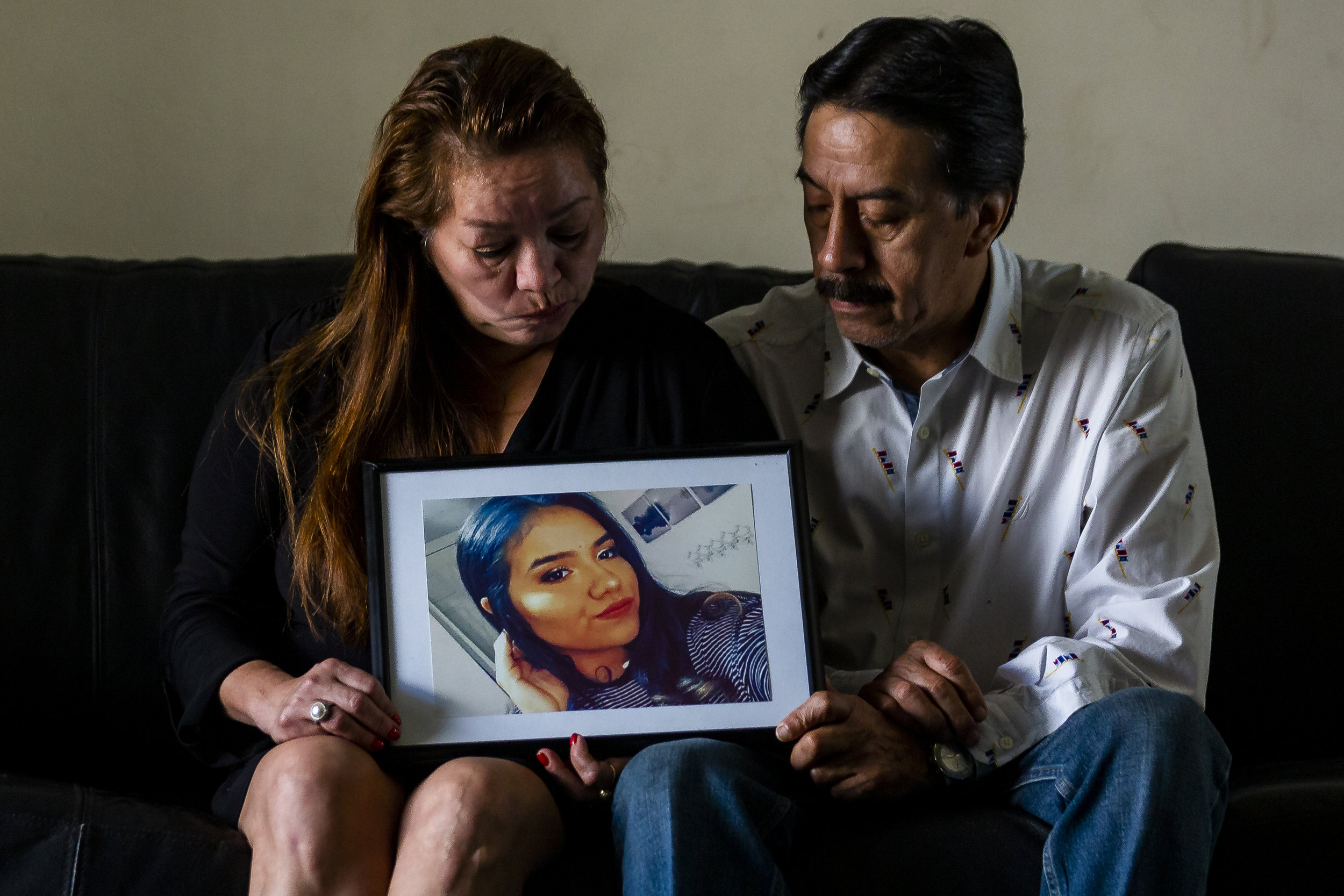  Gina Duran, left, and her husband, Orlando Duran, look at a photo of their daughter Alexa Duran at their home in Miami, Florida on Sunday, December 23, 2018. Alexa Duran, 18, was driving her father's car the day the FIU bridge collapsed. She was one