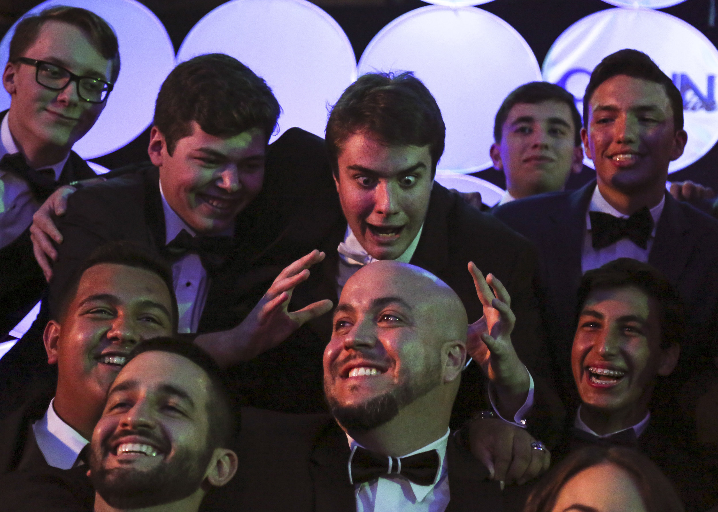  Phillip Bootsma, center top, makes a funny face while taking a group picture with CCNN live moderator Omar Delgado, center bottom, during the 3rd Annual Media Excellence Awards at Christopher Columbus High School on Saturday, April 16, 2016. The cer