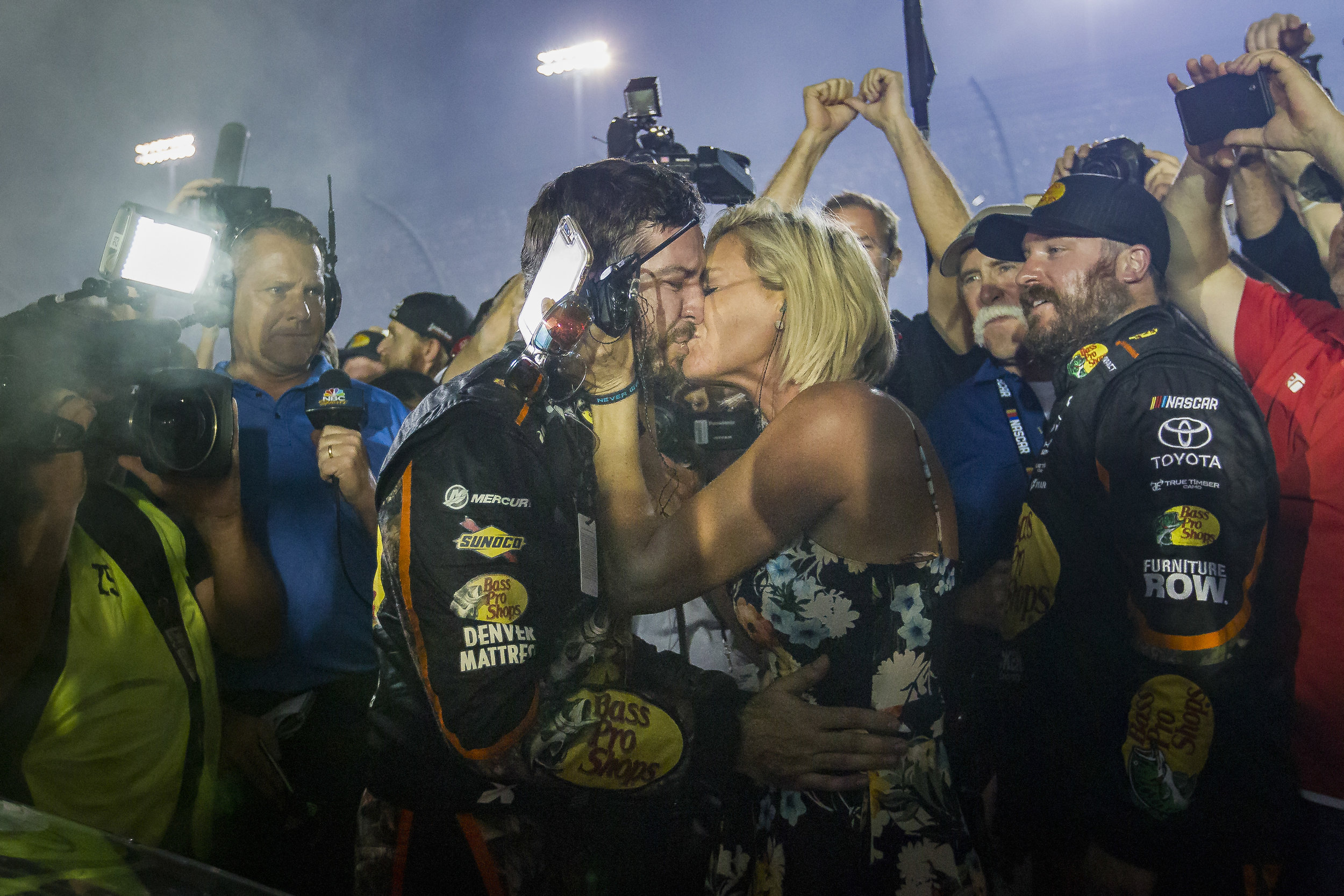  Martin Truex Jr. #78 kisses his wife after winning the Monster Energy NASCAR Cup Series and the Ford EcoBoost 400 Championships at the Homestead-Miami Speedway on Sunday, Nov. 19, 2017. 