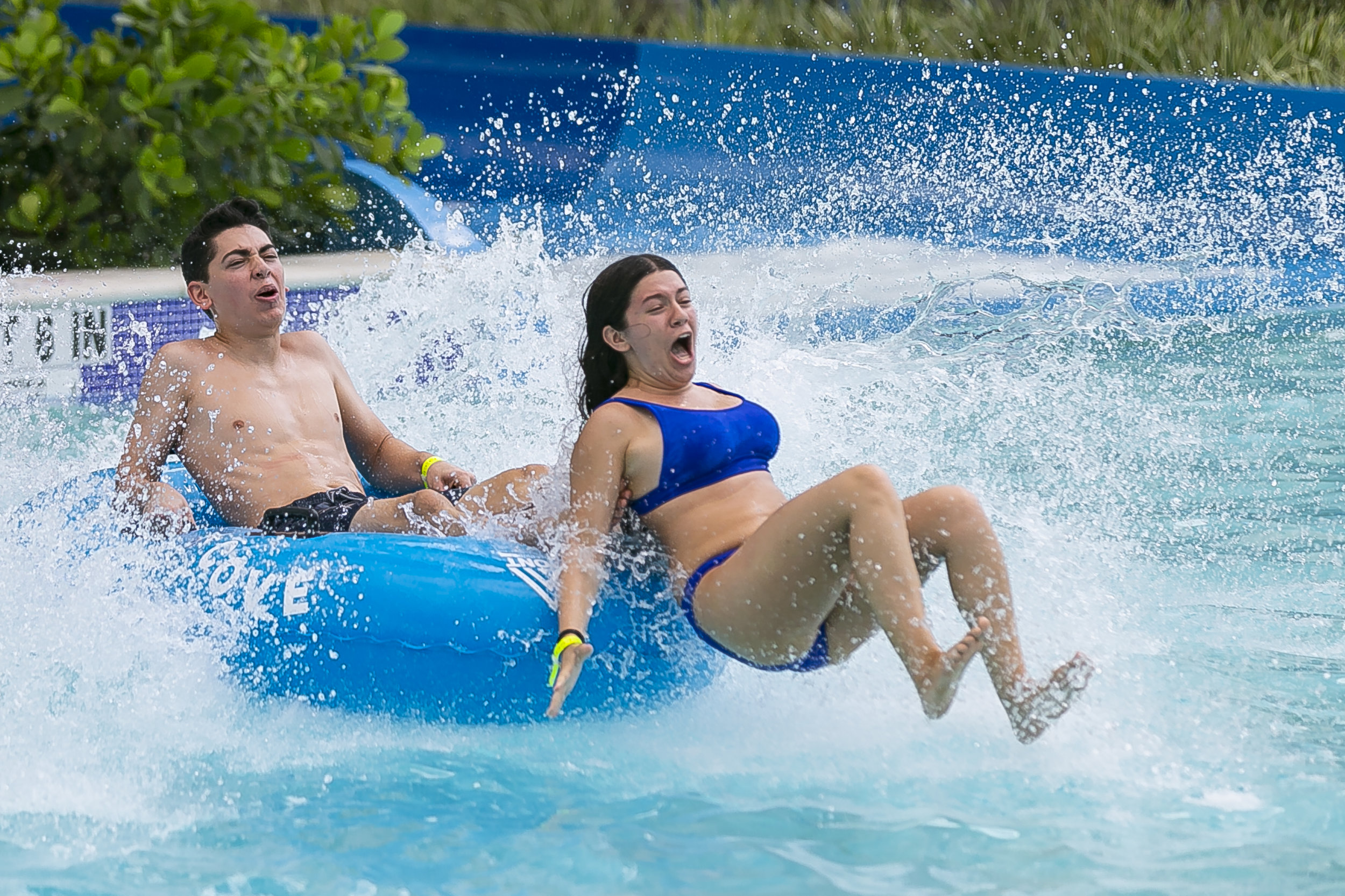  Brenda Martinez, 17, and her cousin, Jonathan Martinez, 17, go down a waterslide at Tidal Cove Waterpark in Aventura's JW Marriott Miami Turnberry Resort &amp; Spa on Saturday, June 8, 2019. The park has seven water slides, a FlowRider surfing pool 