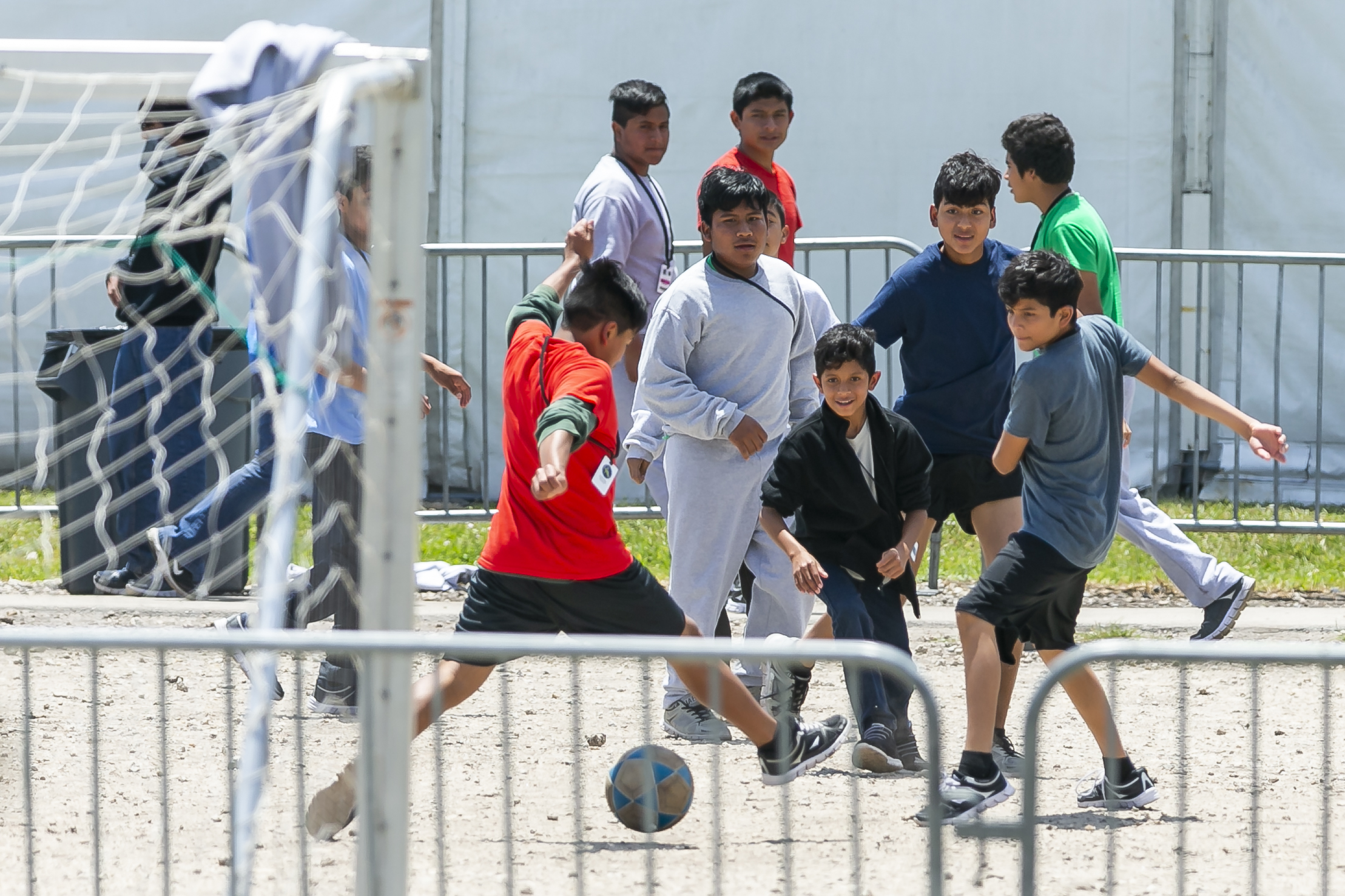  Migrant children play soccer inside the Homestead Temporary Shelter for Unaccompanied Children on Good Friday in Homestead, Florida on April 19, 2019. 