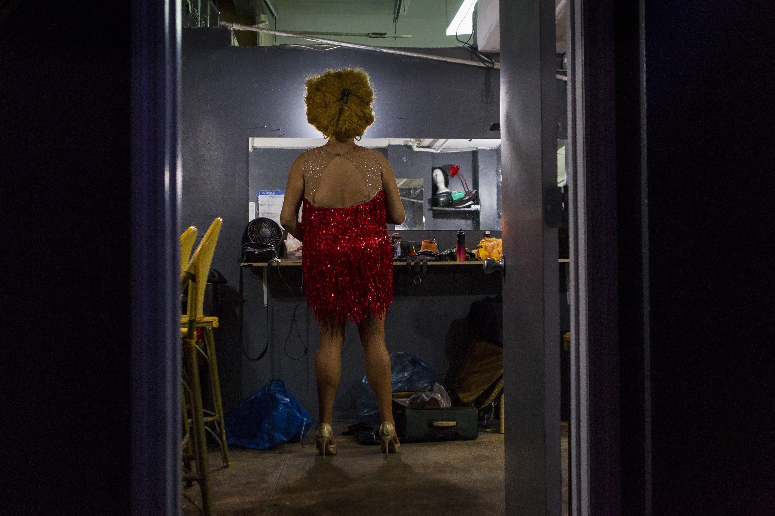  Noel Leon, 37, puts on clothes in a dressing room at the Palace Bar in Miami Beach on Wednesday, Jan. 31, 2018. Leon is an entertainer at the Palace. 