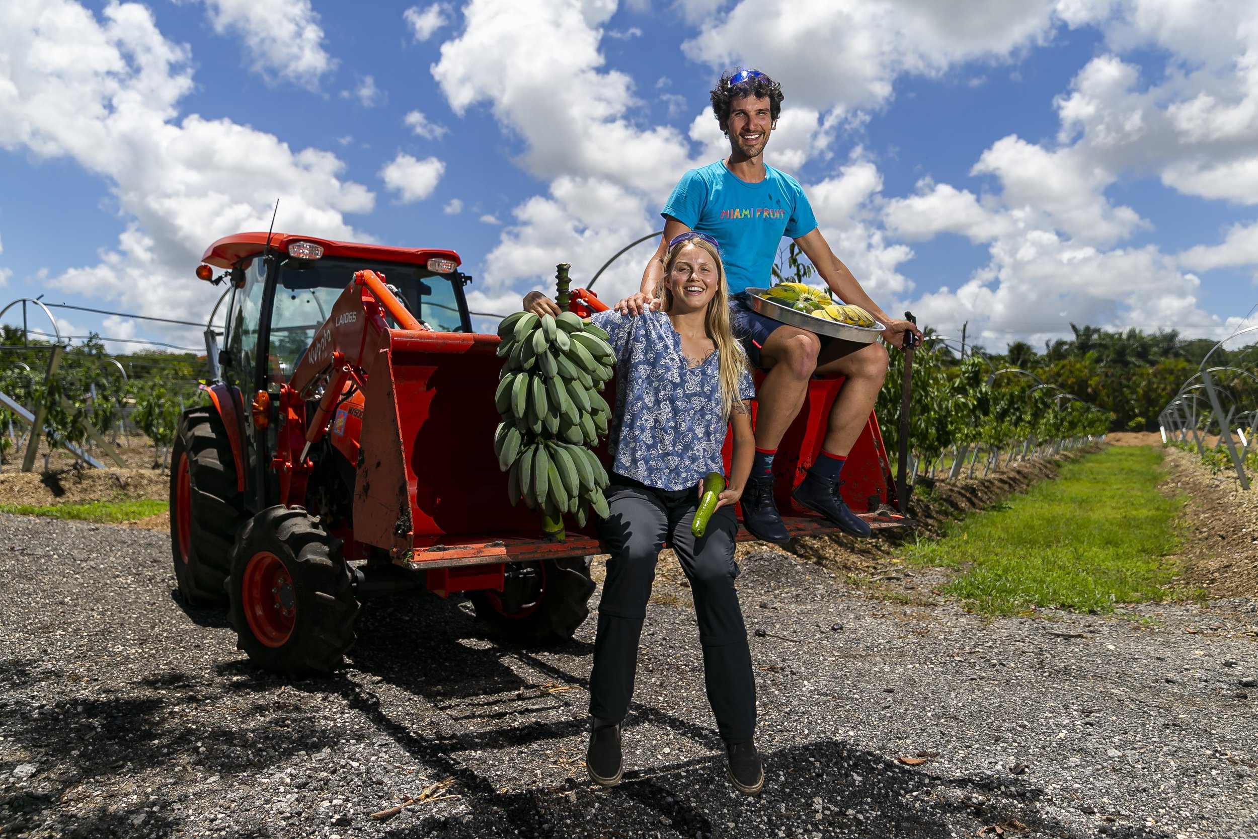  Rane Roatta, 29, and Edelle Schlegel, 25, the founders of Miami Fruit, hold some of the products they sell online from their farm on Wednesday, July 30, 2022 in Homestead, Fla. Miami Fruit, an online company that sends boxes of fruits to customers a