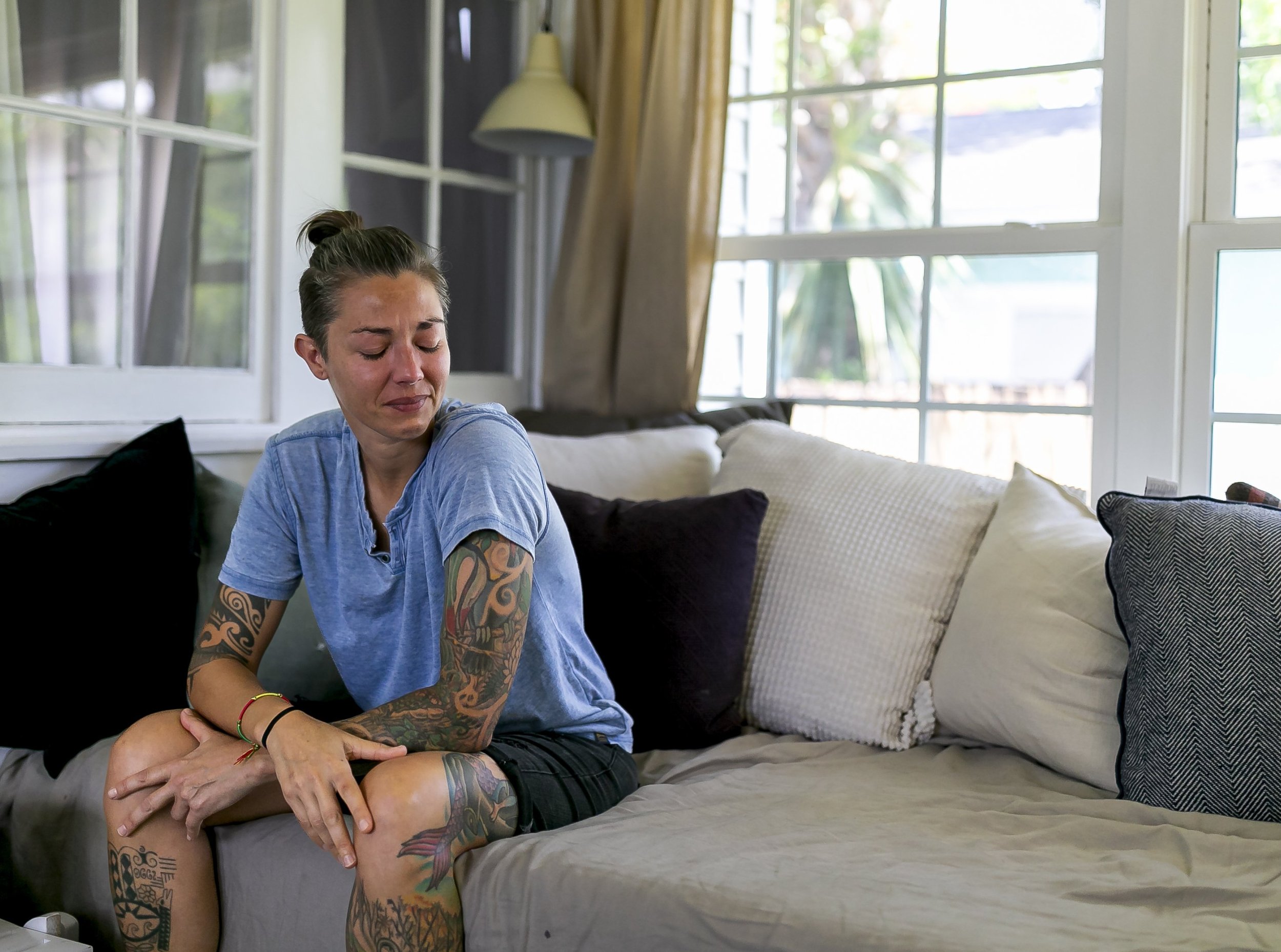  Broward Sheriff’s Office Battalion Chief Nichole Notte, 41, is photographed at her home on Tuesday, June 21, 2022 in Fort Lauderdale, Fla. Notte, who was a first responder during the Champlain Towers South condo collapse in Surfside, has been dealin