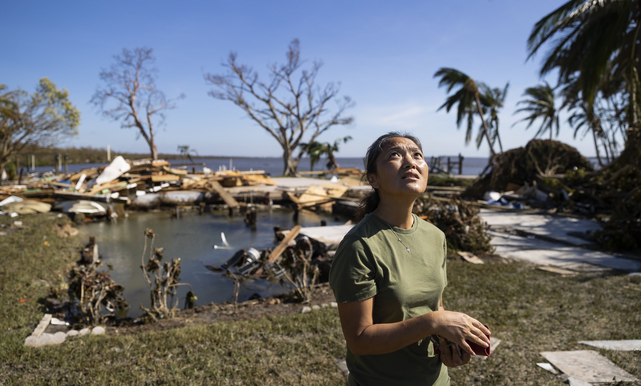  Jane Cecil, 54, looks to the sky in front of what was her home on Thursday, Sept. 29, 2022, in Matlacha, Fla. Hurricane Ian made landfall on the coast of South West Florida as a category 4 storm Wednesday afternoon leaving areas affected with floode