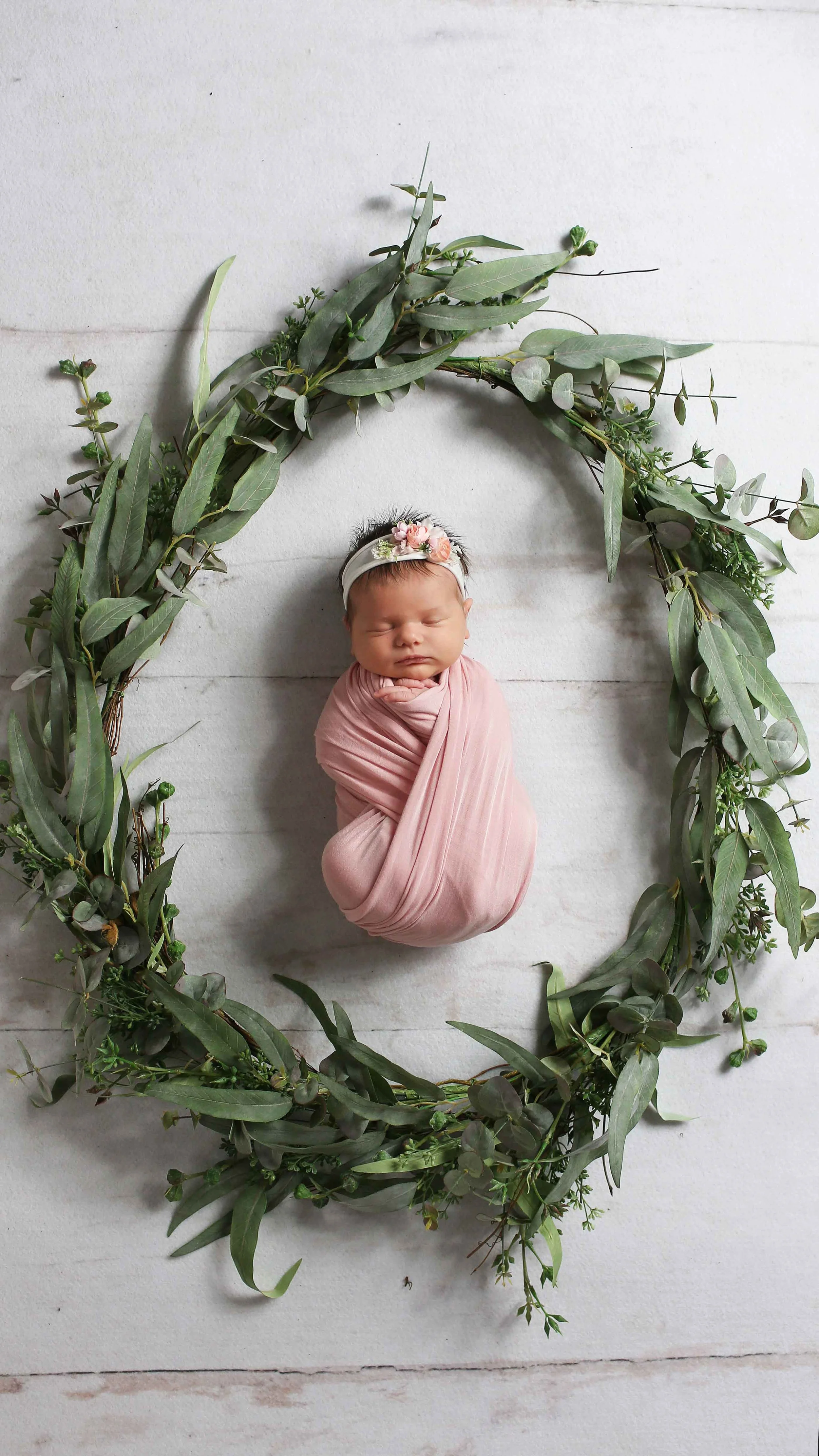 Truly You Photography Oklahoma Newborn girl bundled surrounded by green wreath