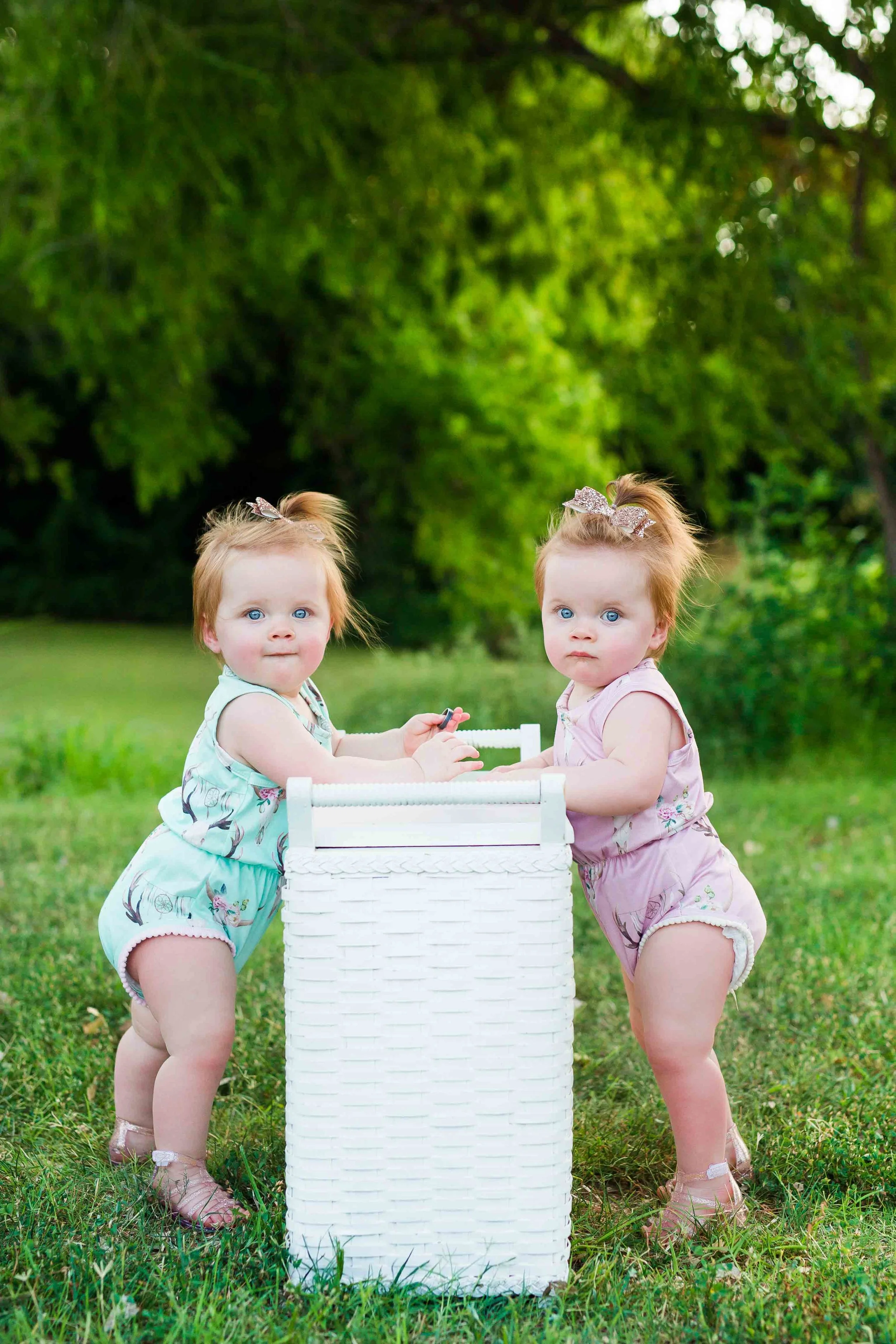 Truly You Photography Oklahoma children twin girls leaning on white desk in yard