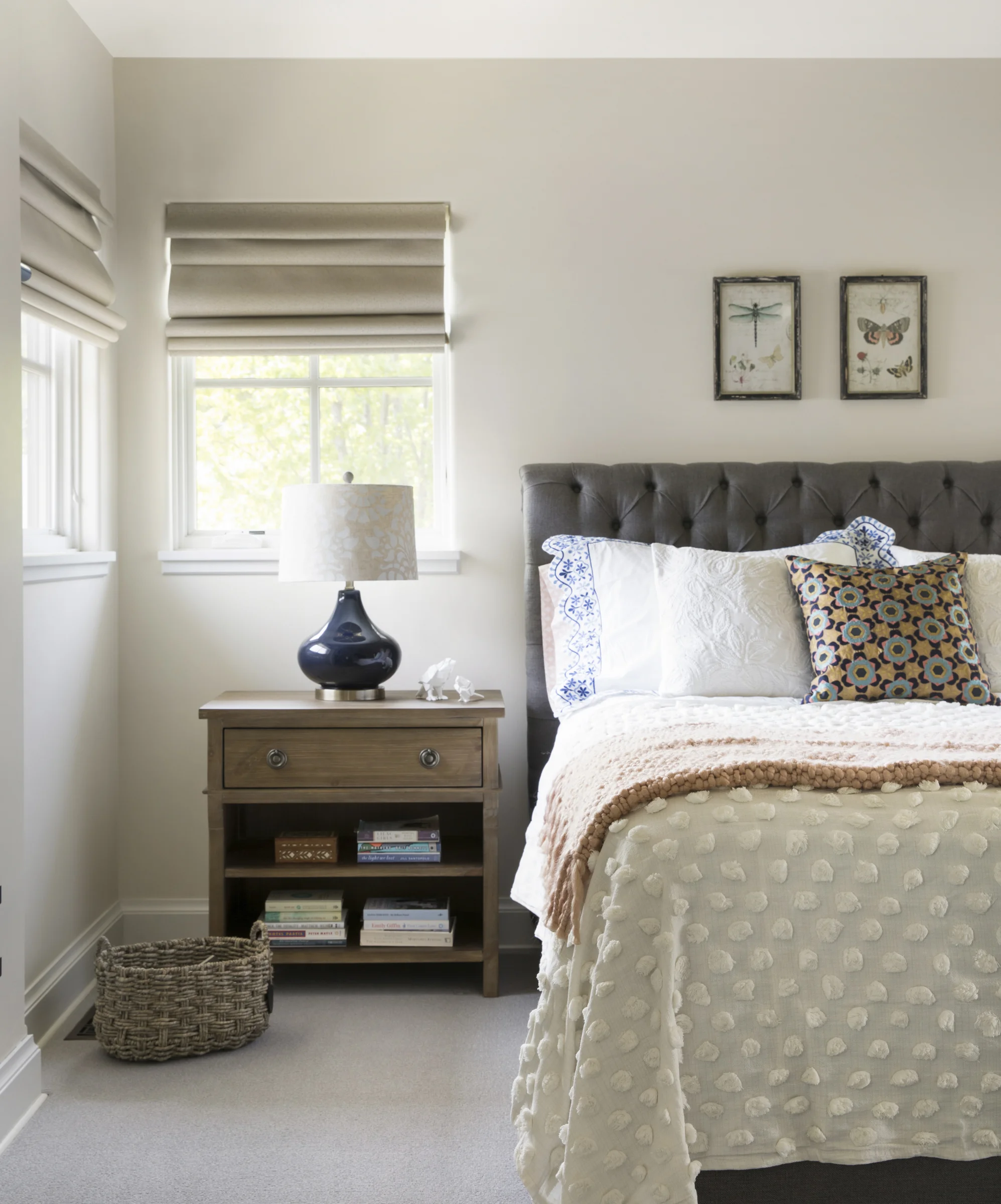 After: We added height with the upholstered headboard and brought in more substantial nightstands for balance.