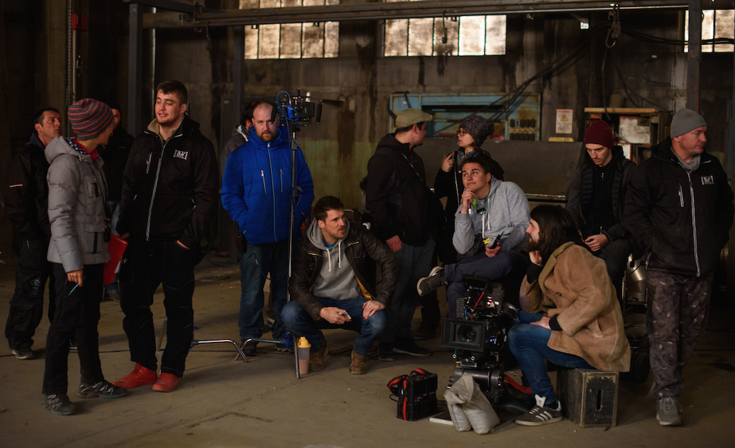 Giles Alderson on set of The Dare as the team discuss the next shot