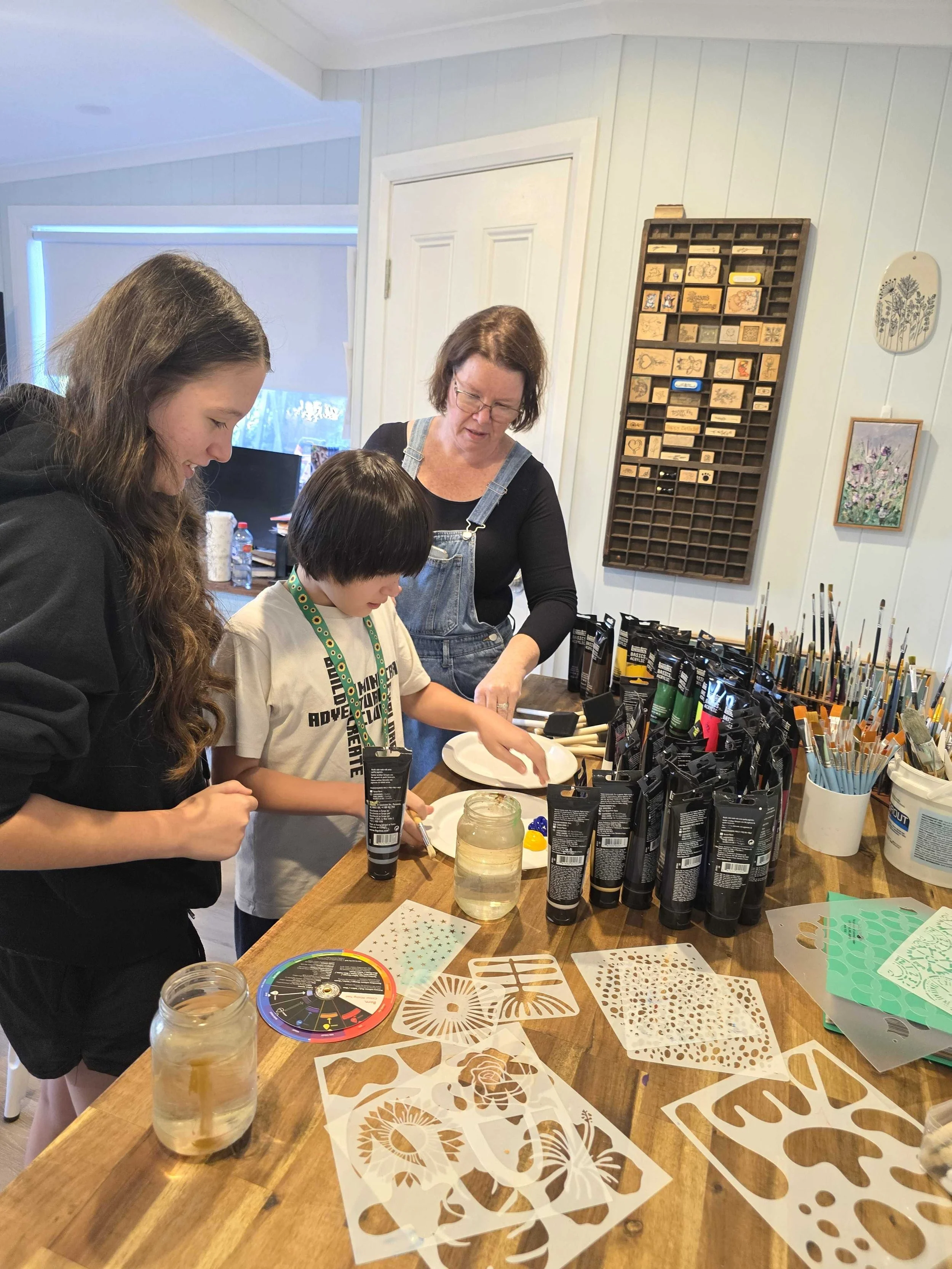 Family creating artwork together at Artfulness studio in Windsor NSW during a Hawkesbury family art experience