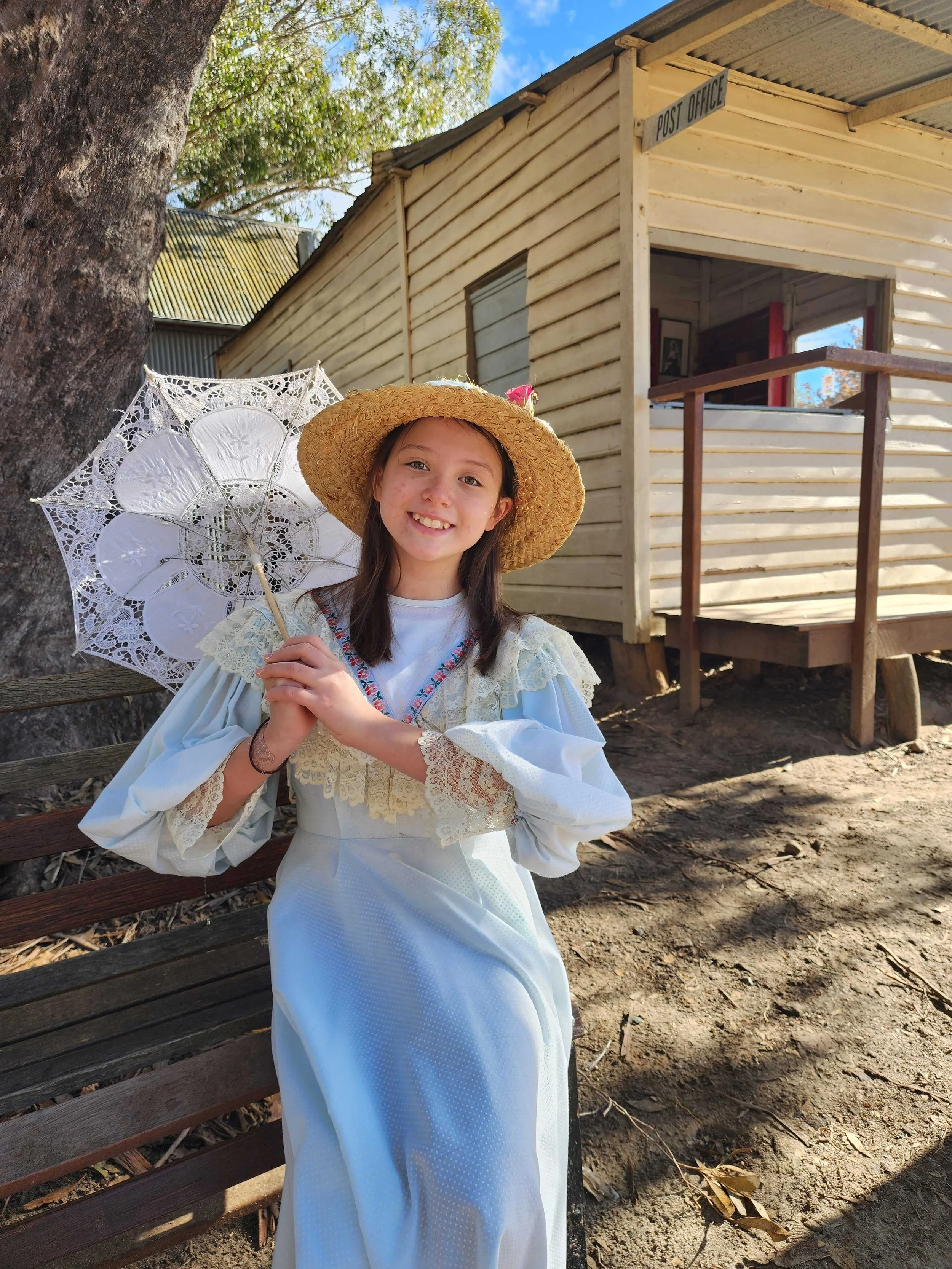 Child dressed in colonial costume at Australiana Pioneer Village in Wilberforce, Hawkesbury NSW