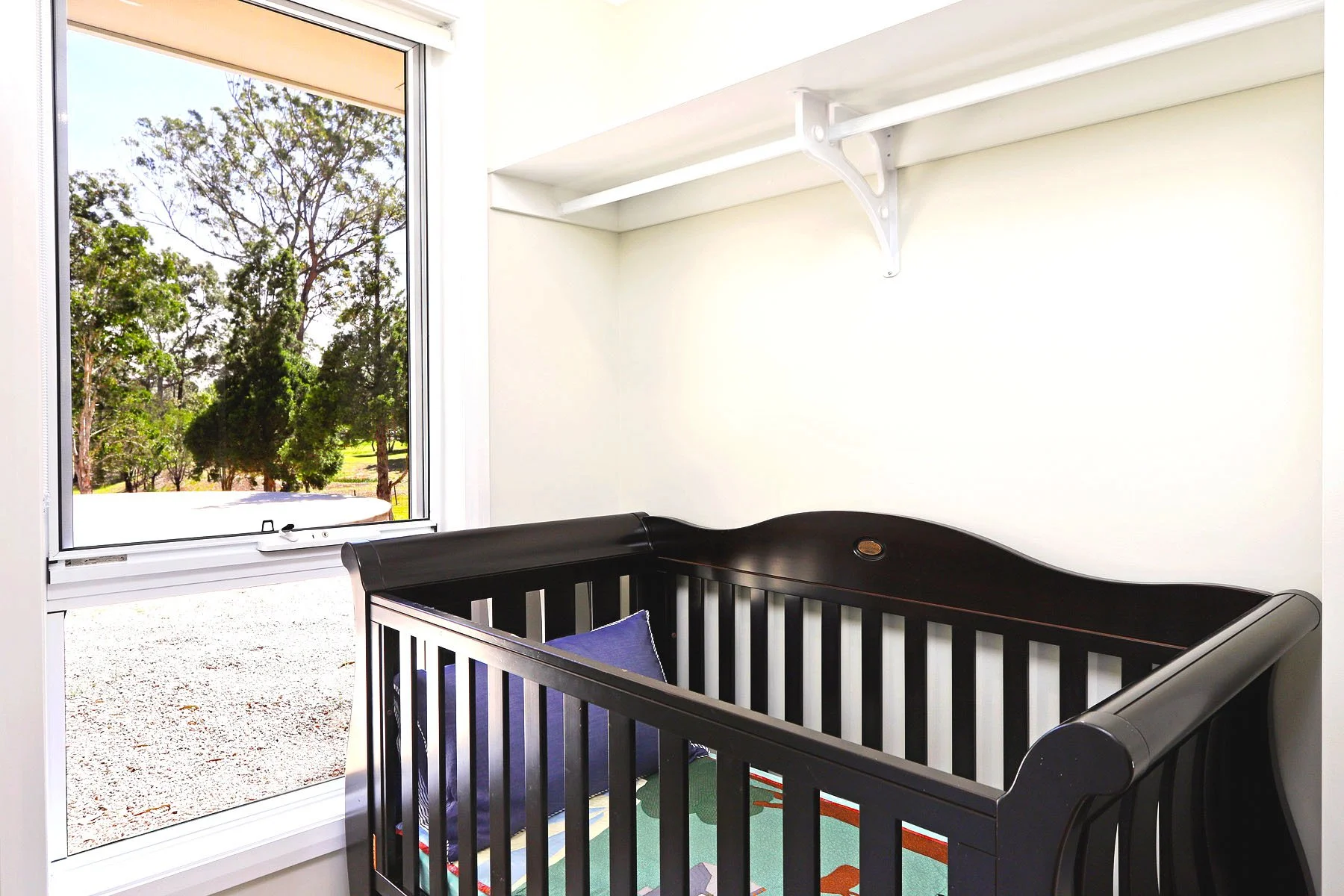 Boori cot provided at Dido's Place family-friendly accommodation in the Hawkesbury, ideal for families travelling with babies.