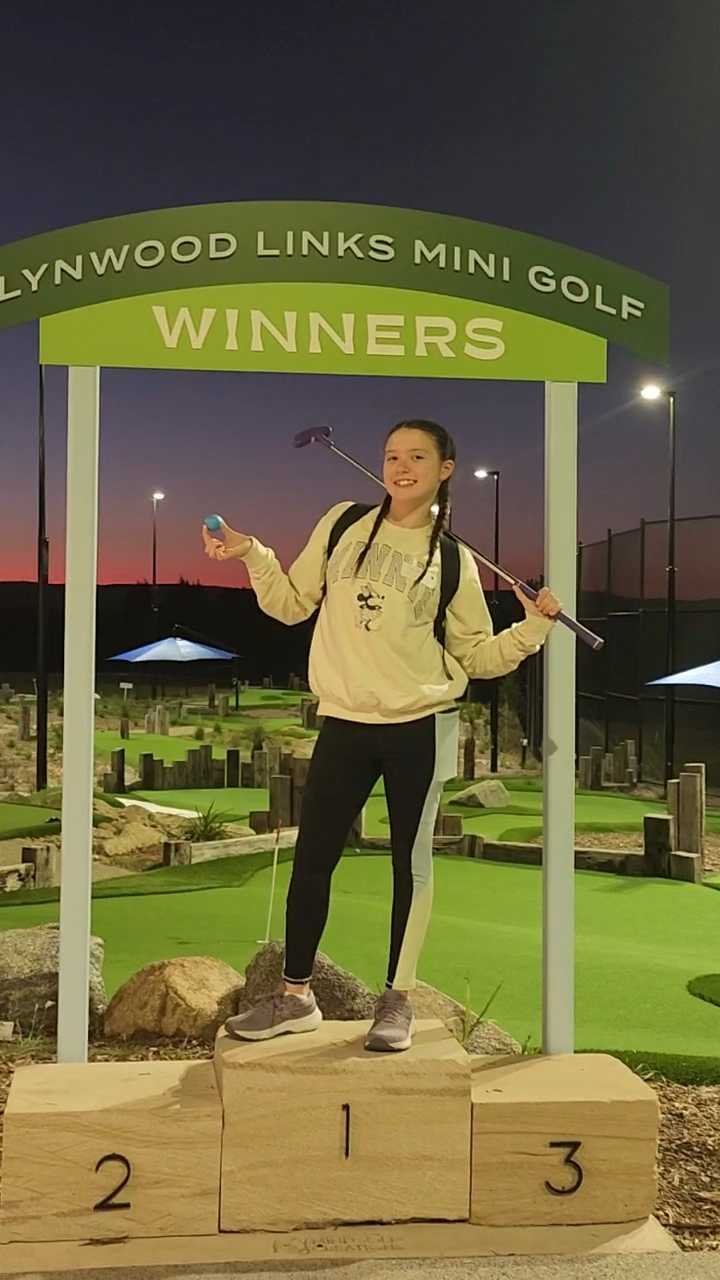 Child playing mini golf at Lynwood Links Mini Golf in Pitt Town, Hawkesbury NSW