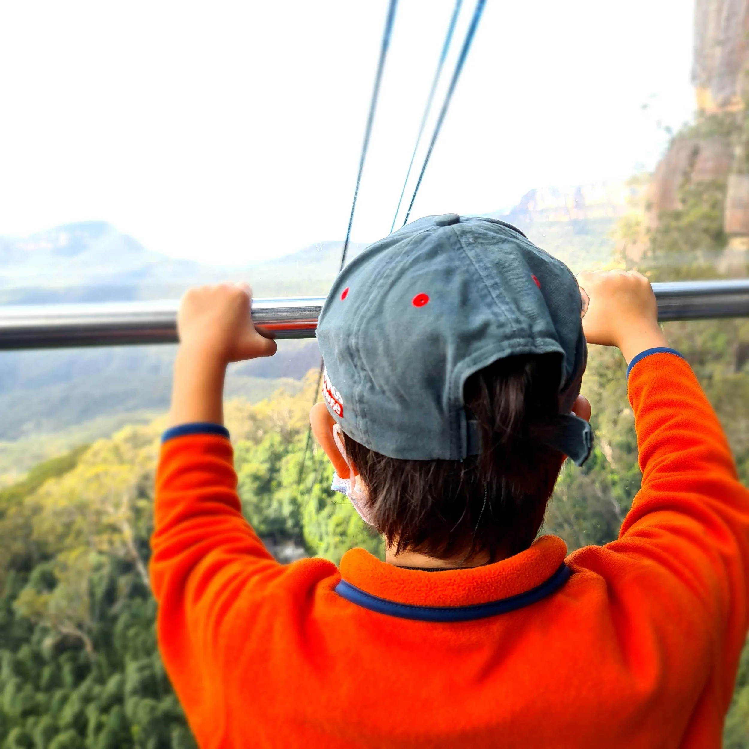Child riding the Scenic Skyway at Scenic World overlooking the Blue Mountains in Katoomba NSW