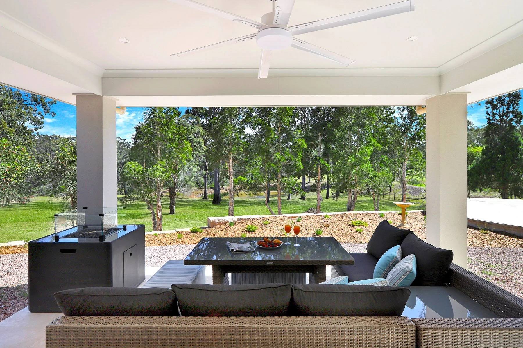 Covered outdoor entertaining area at Dido's Place Hawkesbury accommodation with alfresco dining, lounge seating and views across private acreage.