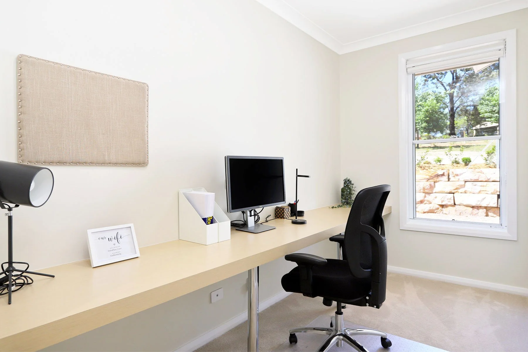 Dedicated study with desk, office chair and monitor at Dido's Place Hawkesbury accommodation, ideal for remote work.