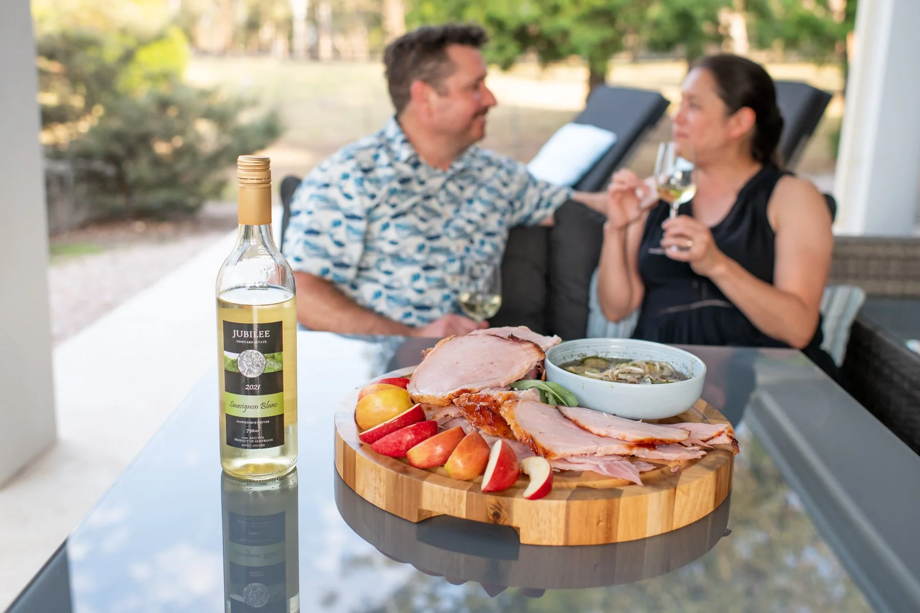 Parents relaxing with local food and wine at Dido’s Place family holiday accommodation in the Hawkesbury NSW.