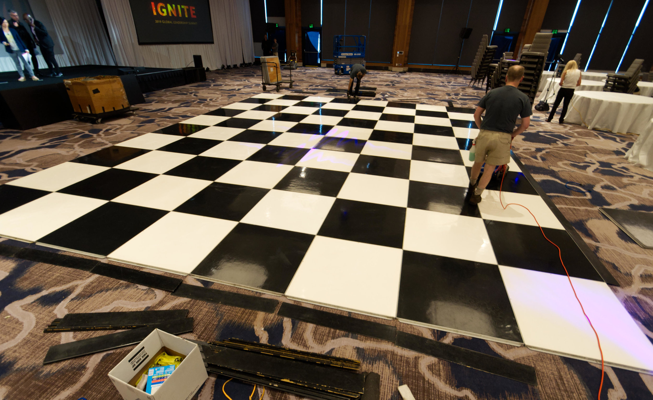  Burnishing a black &amp; white checkerboard dance floor for a  Chateau St. Michel  event at the  Hyatt Lake Washington Hotel  in Renton, organized by  Big Rock Productions . 