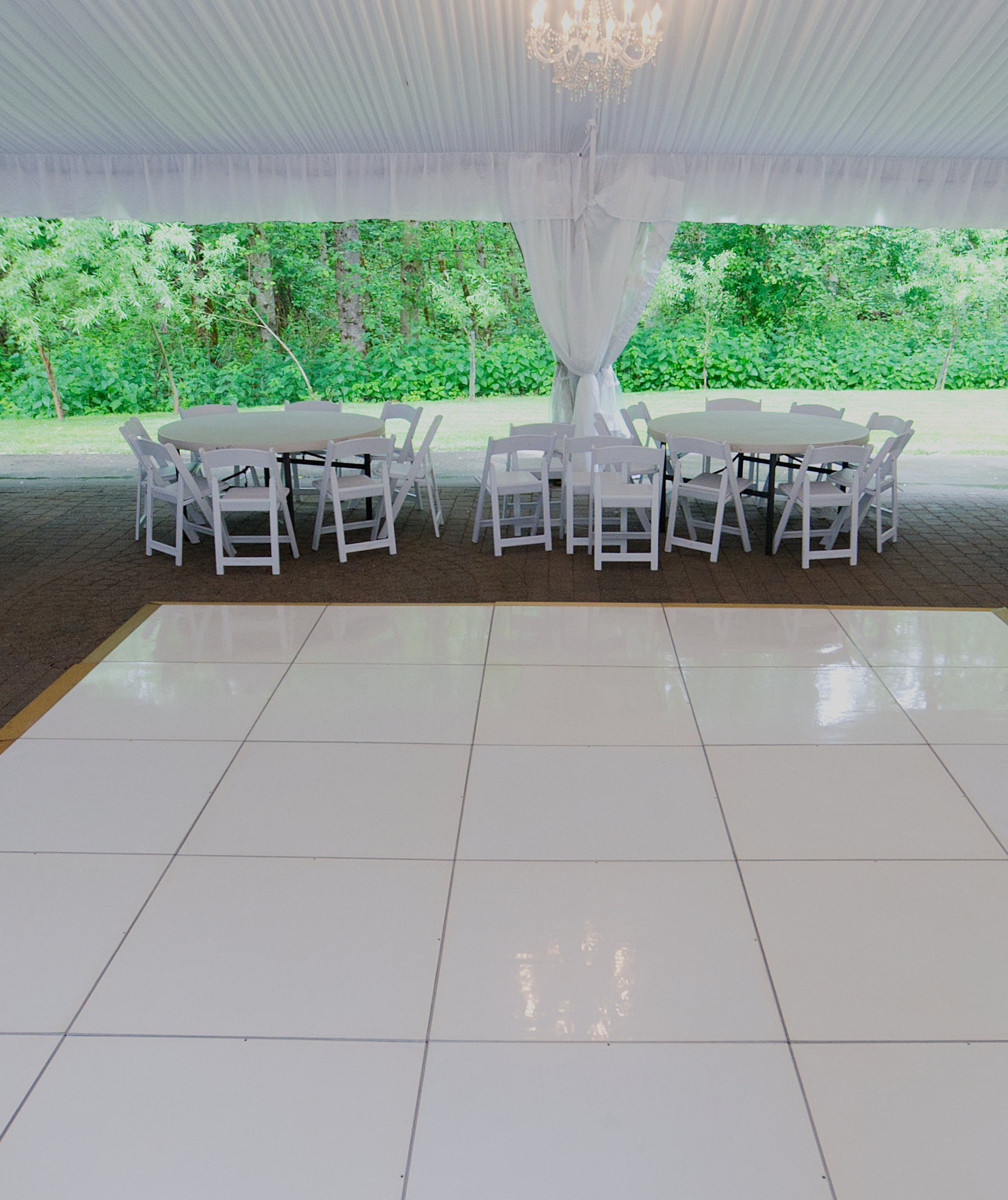  A white dance floor at a wedding reception at  Rock Creek Gardens  in Puyallup. 