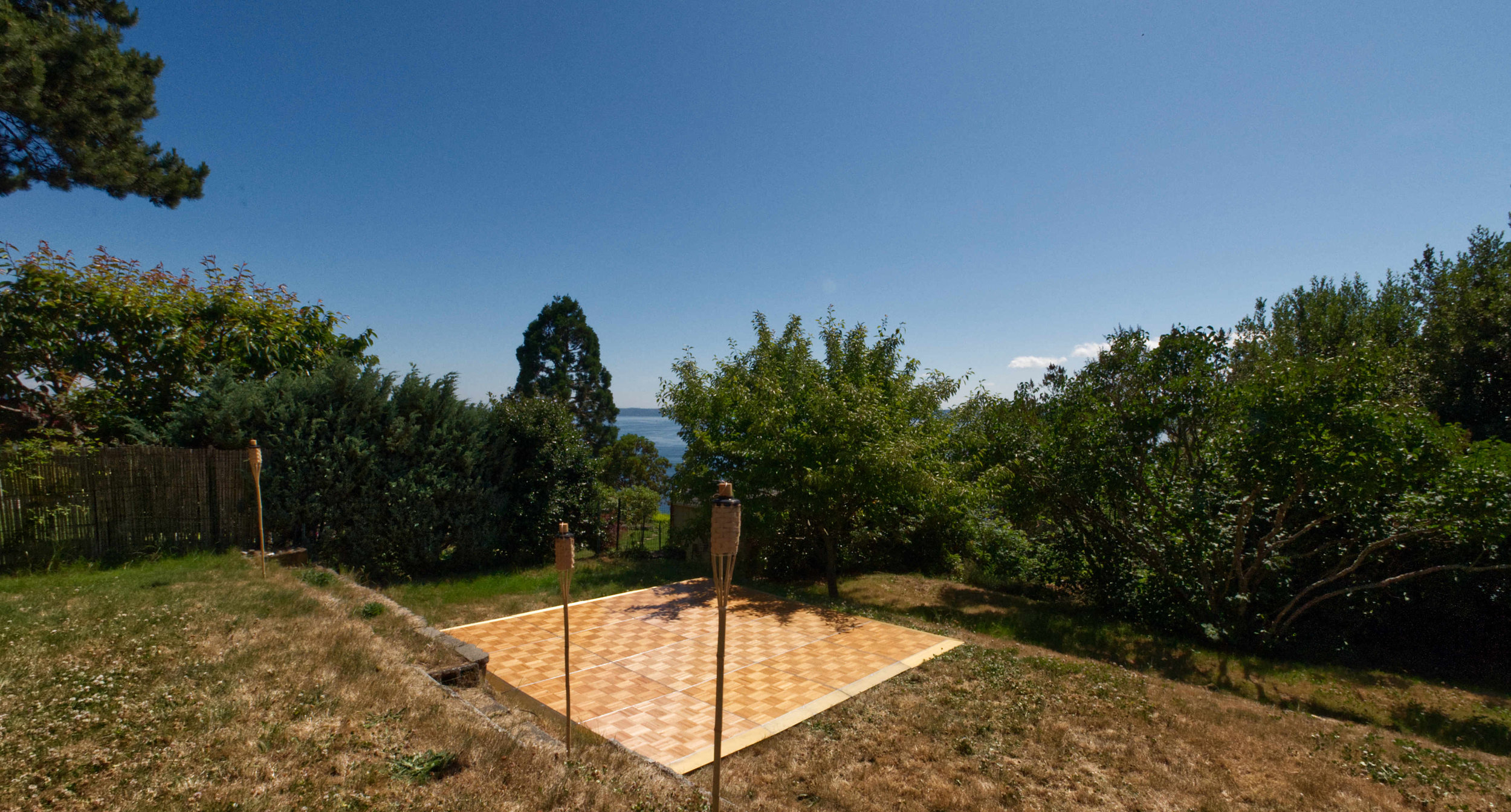  12’ by 12’ oak dance floor for a backyard graduation party. 