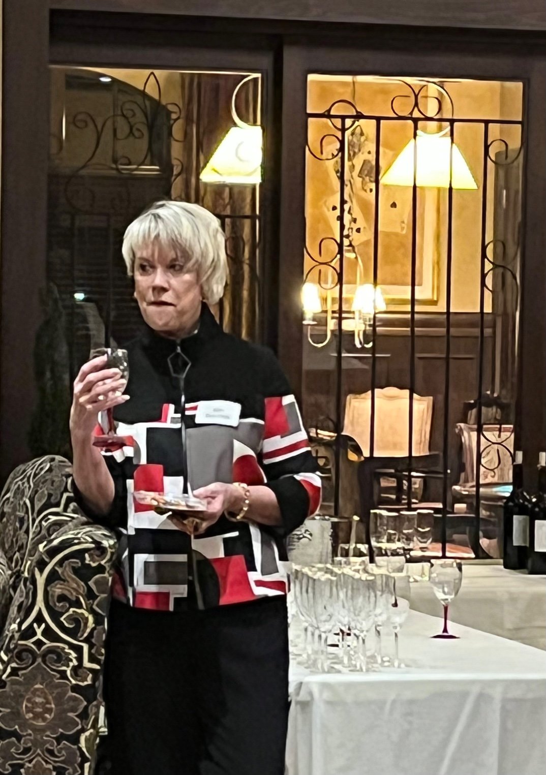 Kim Bacchus concentrates on the taste of a Pinot