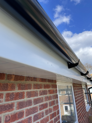 White Fascia and Soffit with Black Guttering
