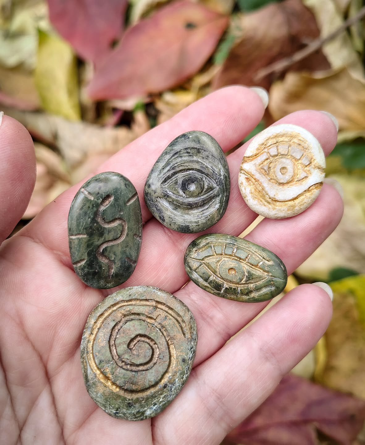A lot of years ago, when I started to make jewelry, it was macram&eacute;, and I didn't have gemstones. I would have tiny little walks (agoraphobia was at its worst back then) and gather the rocks I found cute. Sometimes I would draw on them.
The who