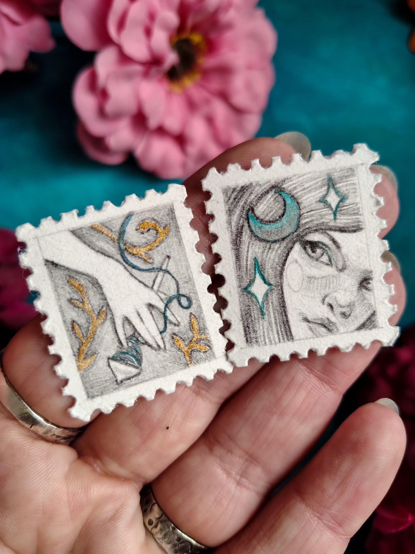 I thought...how tiny can I draw? And then I painstakingly cut these stamps on good thick art paper (I am aware punches exist for this, but I am broke). And then I made these two babies, with a touch of magic glimmer.
I'd like for them to find a home,