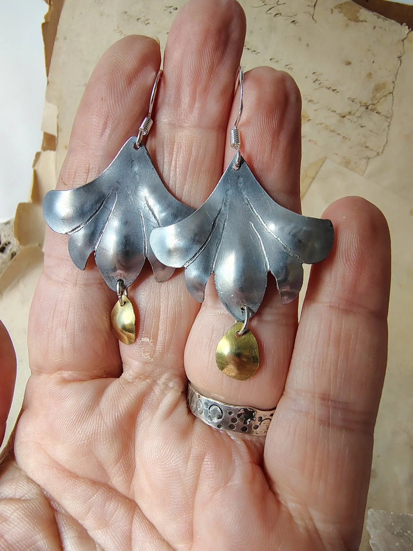 I have been playing around a little while sick. These are all made with the most basic tools (saw, file, stamps) that I could use inside while being all feverish.
I like them. Simple but effective.
They are all looking for a home.
The hooks are all s
