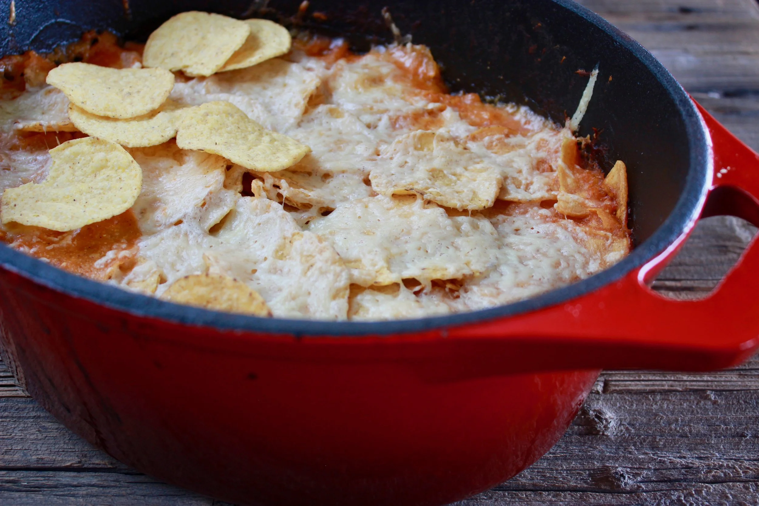 Beans and chicken with a crunchy corn chip and cheese crust