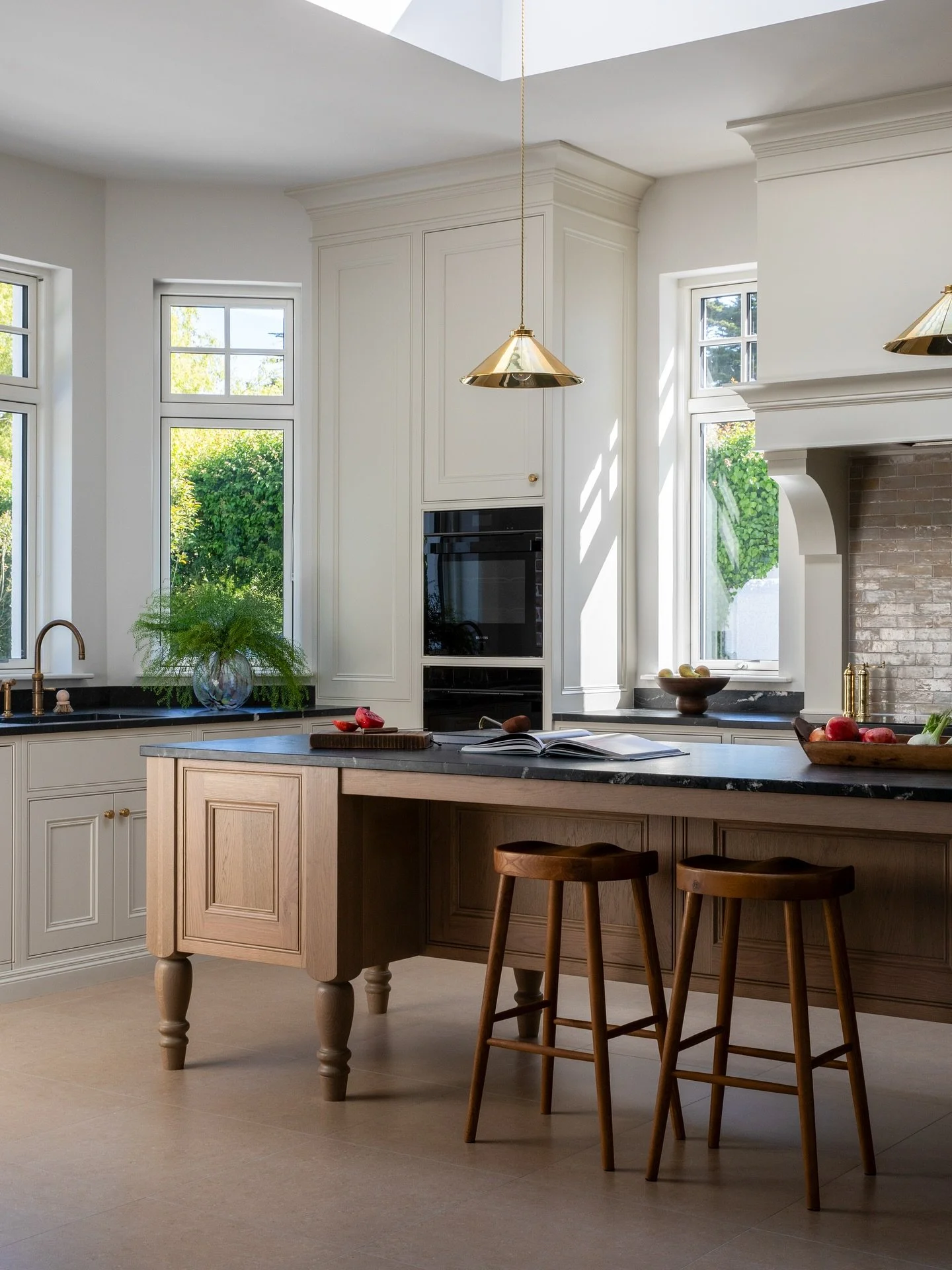 An oak island anchors the kitchen at my Westview project, offering generous prep space and a welcoming spot for gathering. Handmade kitchen cabinetry by Michael Farrell.