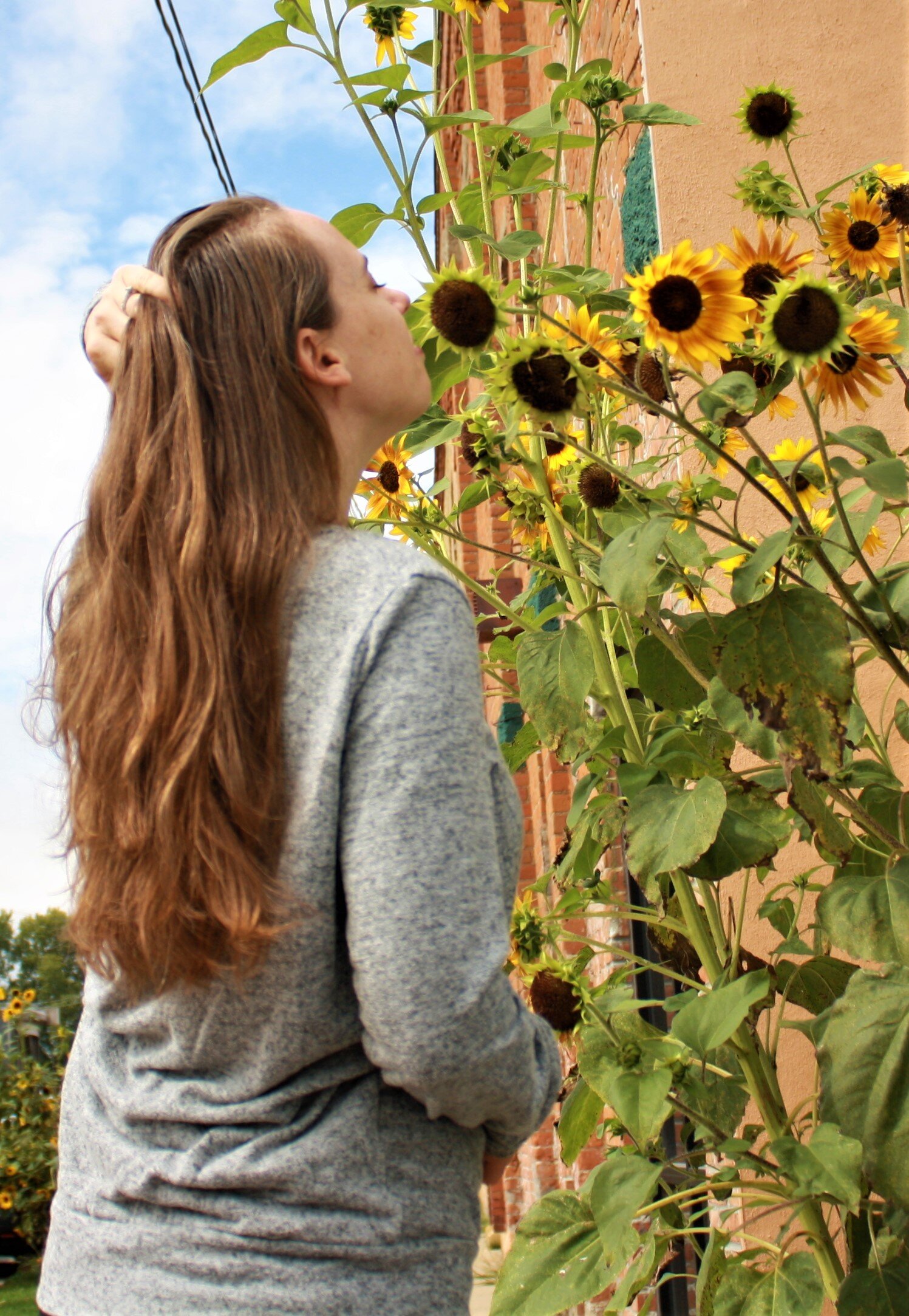 Ashley Smelling Sunflower.jpg