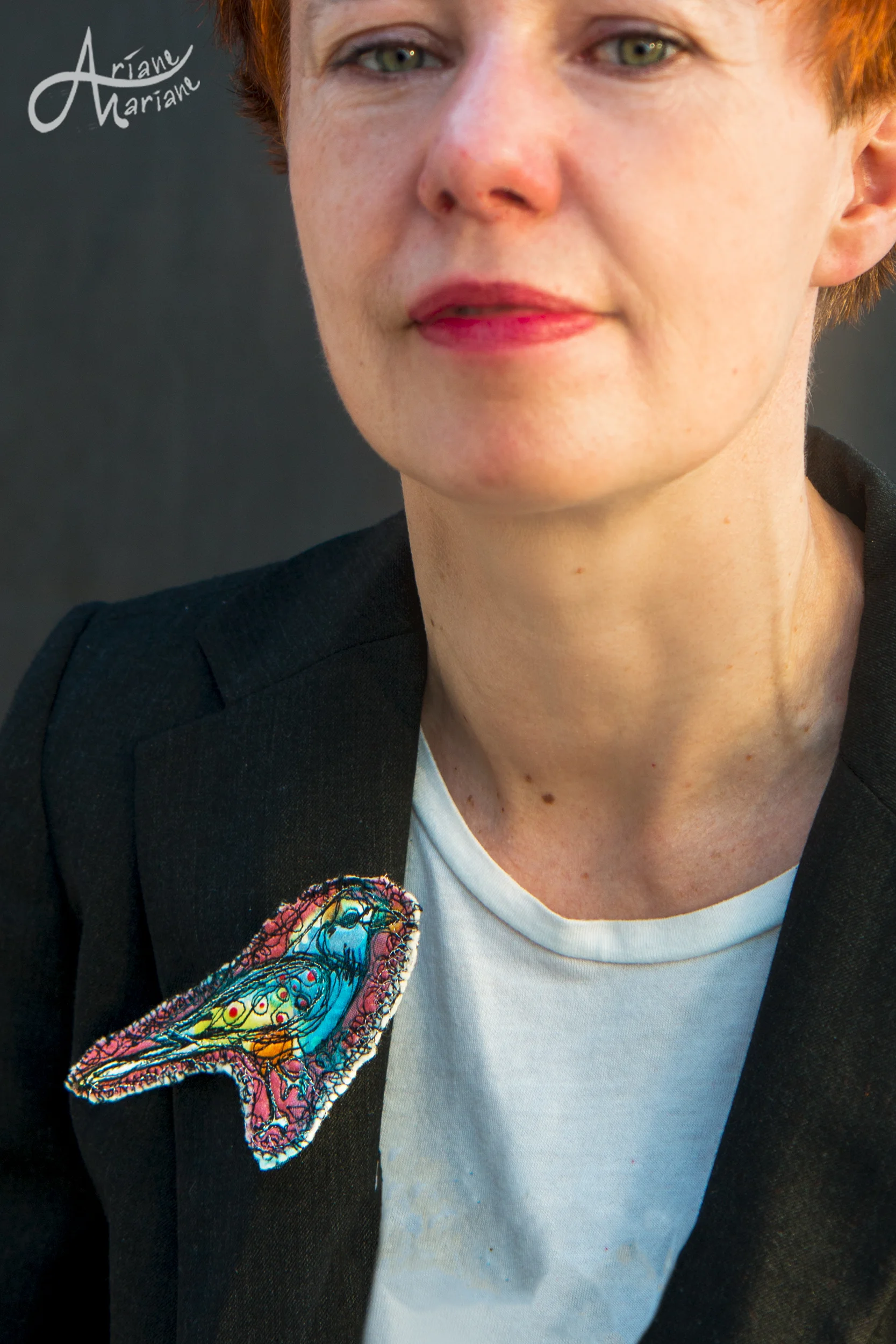 pink-felt-bird-on-jacket.jpg